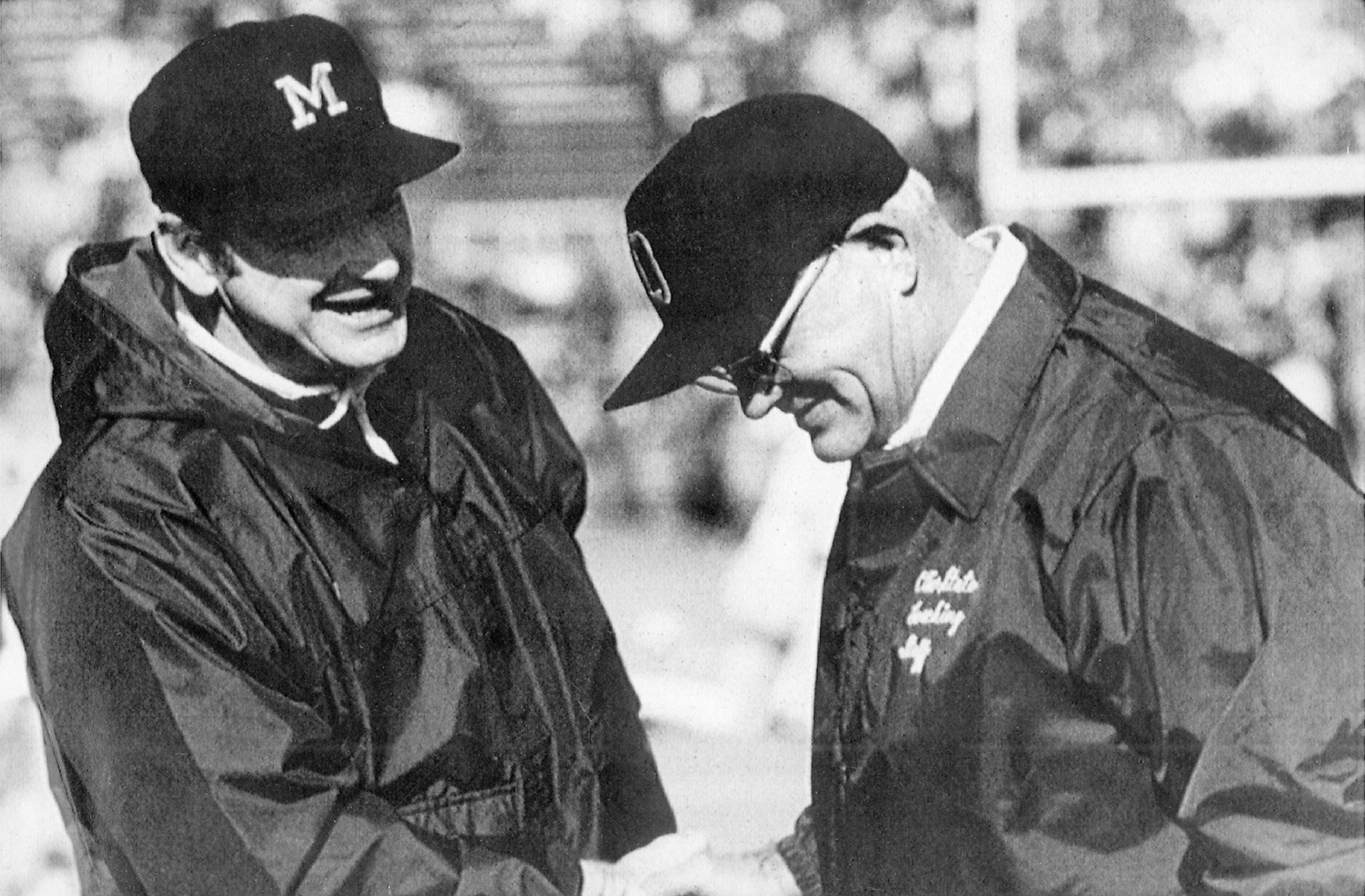 Michigan football coach Bo Schembechler, left, meets with Ohio State coach Woody Hayes in this undated photo, location unknown. Schembechler, the winningest coach in Michigan football history, died Friday, Nov. 17, 2006, after collapsing during the taping of a television show, according to three Detroit TV stations. He was 77. (AP Photo)