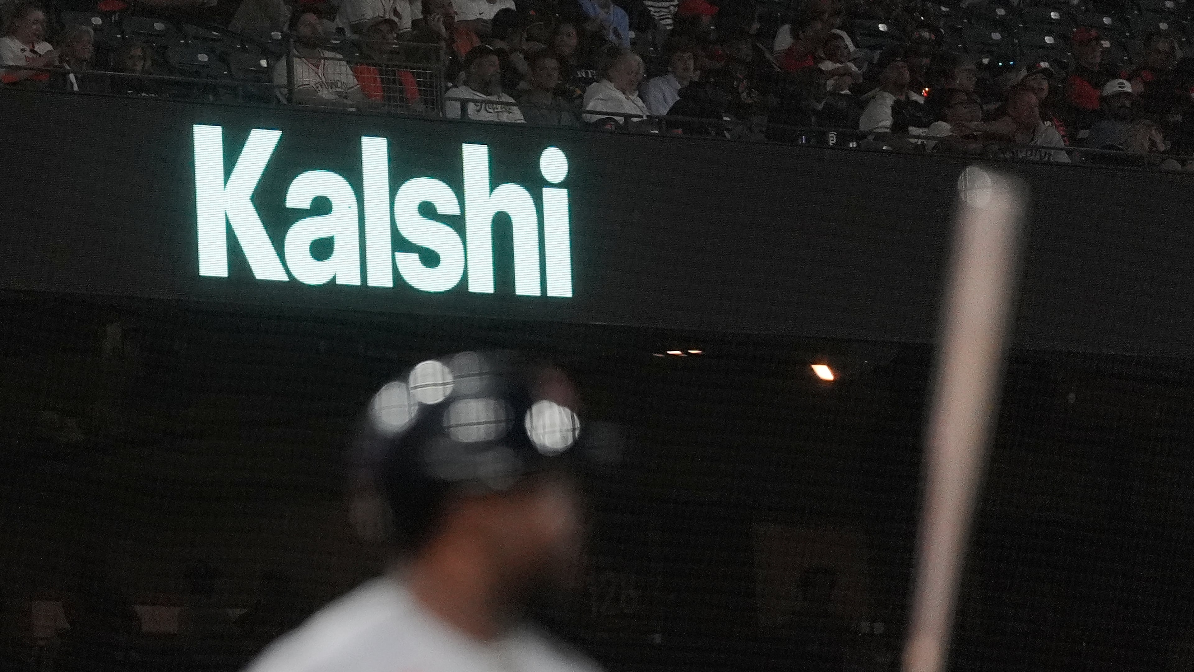 FILE - A Kalshi advertisement is displayed at Oracle Park during a baseball game between the San Francisco Giants and the St. Louis Cardinals, Tuesday, Sept. 8, 2026, in San Francisco. (AP Photo/Jeff Chiu, File)