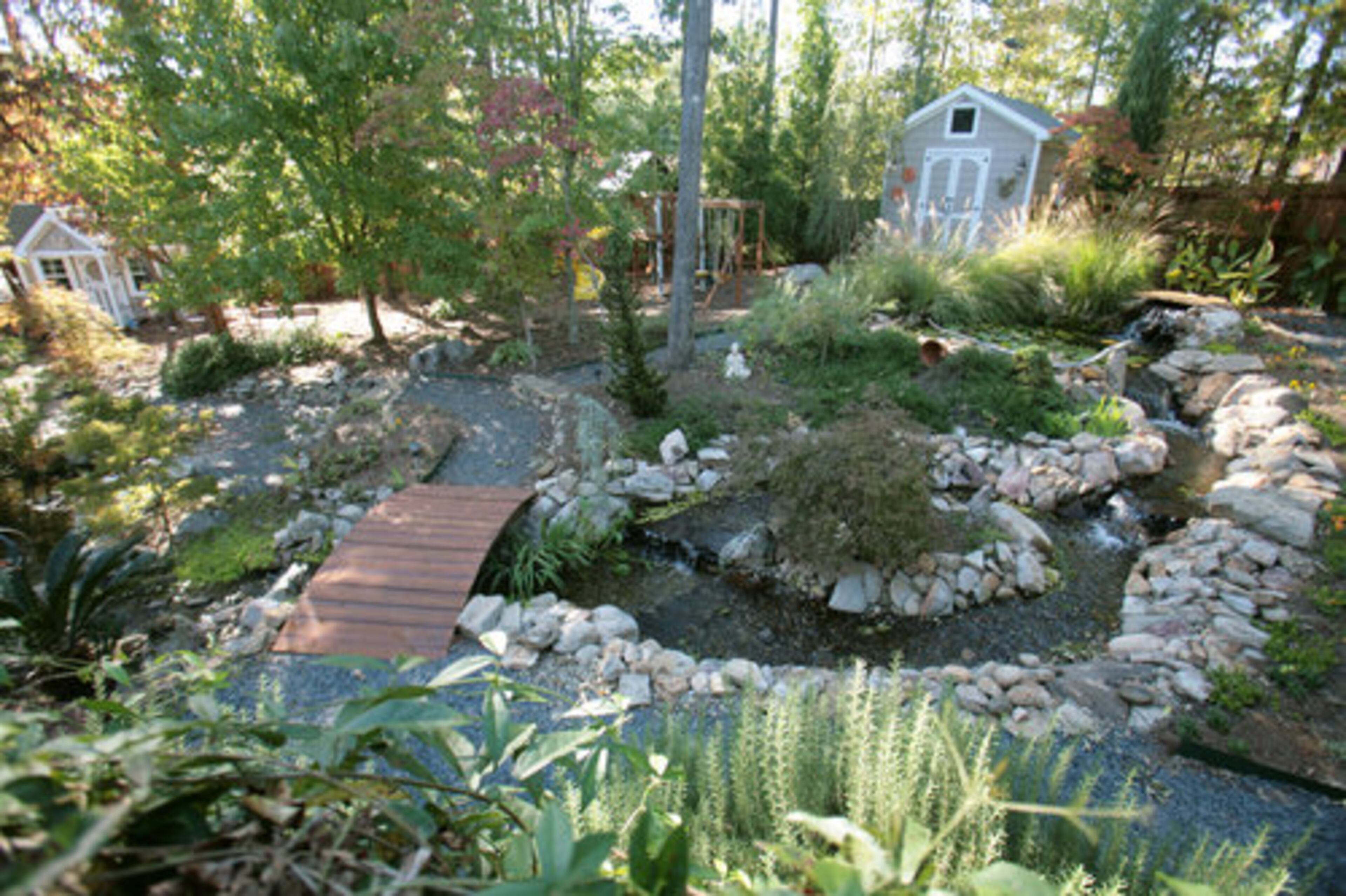 After moving into her suburban Newnan home eight years ago, Delta pilot Kimberly McCraw transformed the once water-logged lot into a swirling water, rock and plant-filled landscape. "It was a nightmare when we moved in," she said. "A river ran through my backyard when it rained."