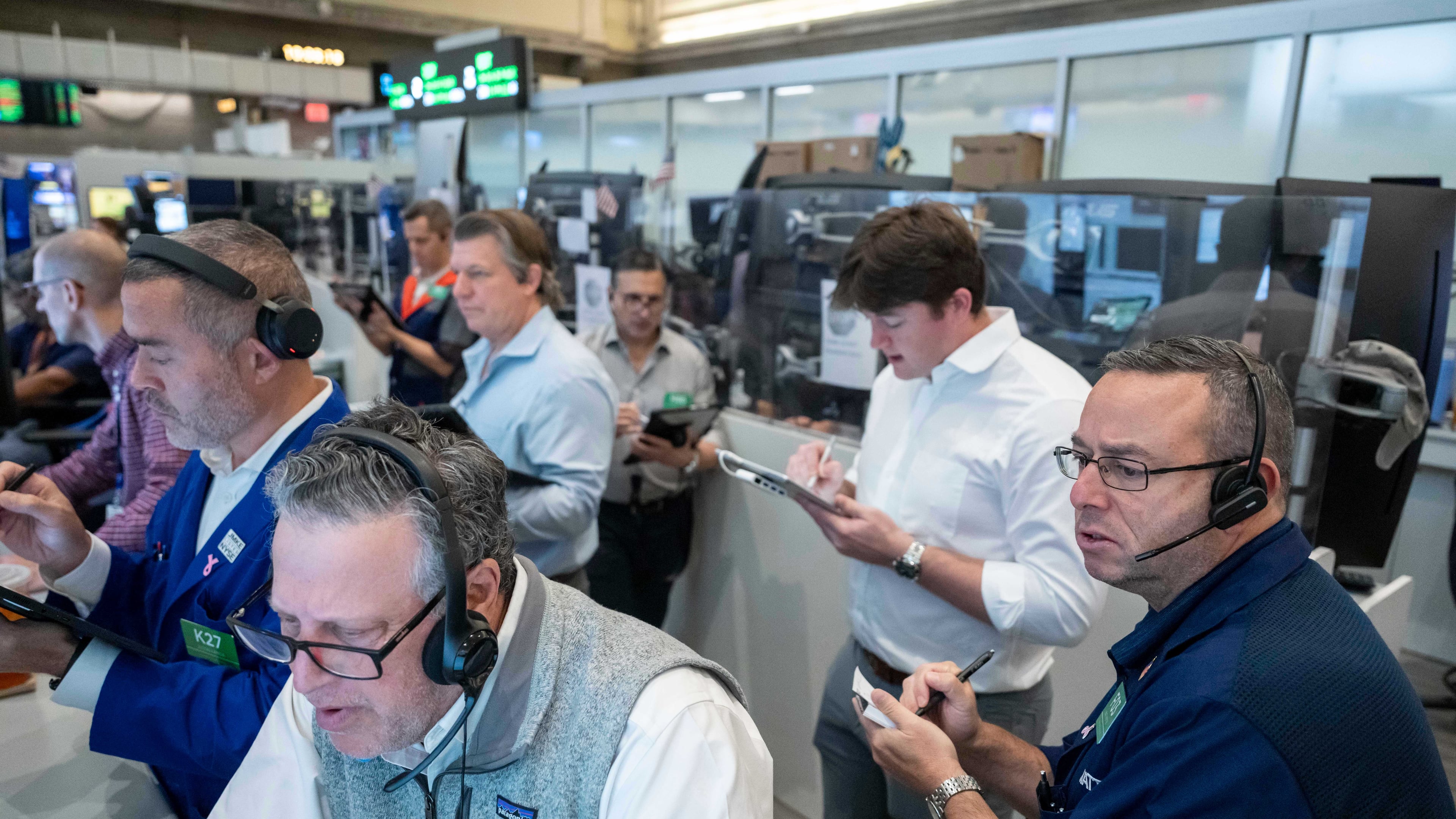 Options traders, including Marty Handler, foreground, and Matt Hefter, right, work on the floor of the New York Stock Exchange, Thursday, Oct. 8, 2026, in New York. (AP Photo/Yuki Iwamura)