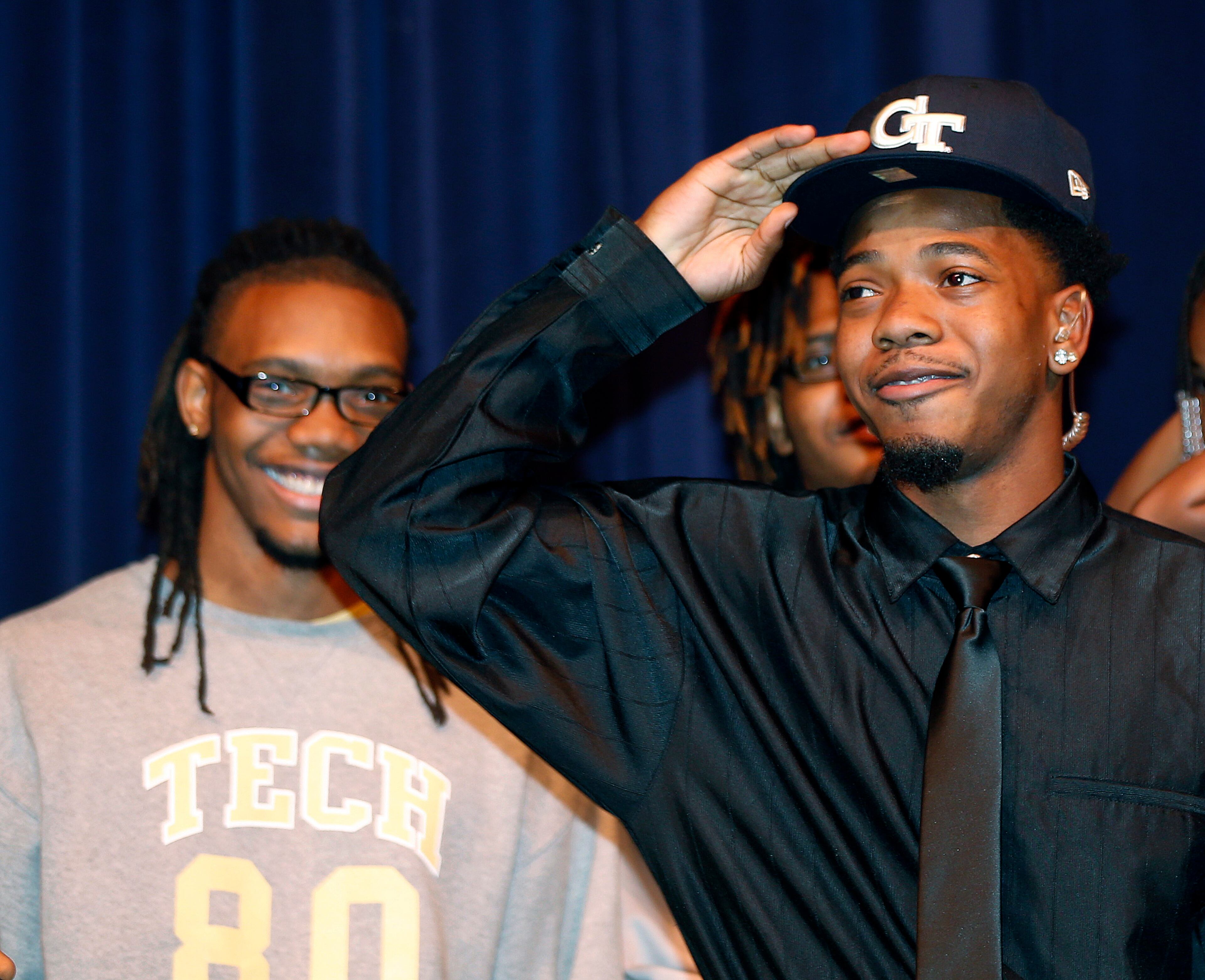 Norcross High School running back Myles Autry, right, announces that he plans attend Georgia Tech and play football, as his brother, and Georgia Tech receiver, Anthony Autry smiles during a news conference Wednesday, Feb. 5, 2014, in Norcorss, Ga.