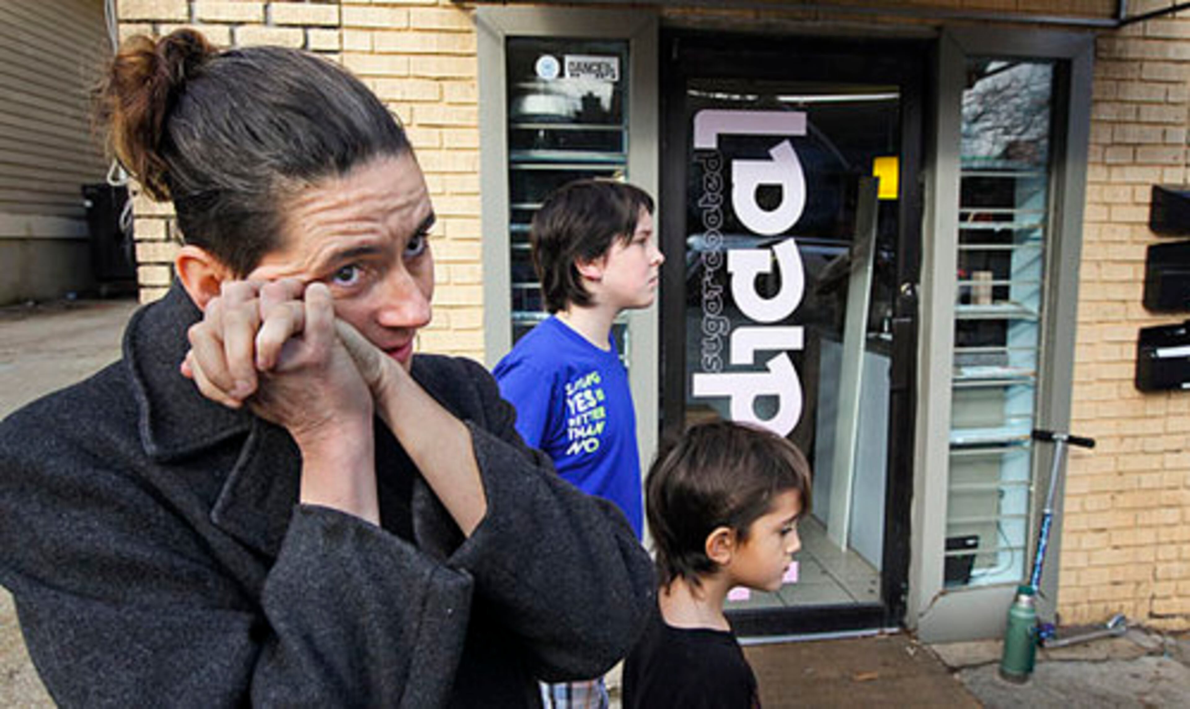 Co-owner of Sugar Coated Radical, Taria Camerino and her sons, Syama Lee, 10, and Maitreya, 7, were shaken up after a home invasion of their apartment, in the same building where the store owner was killed.