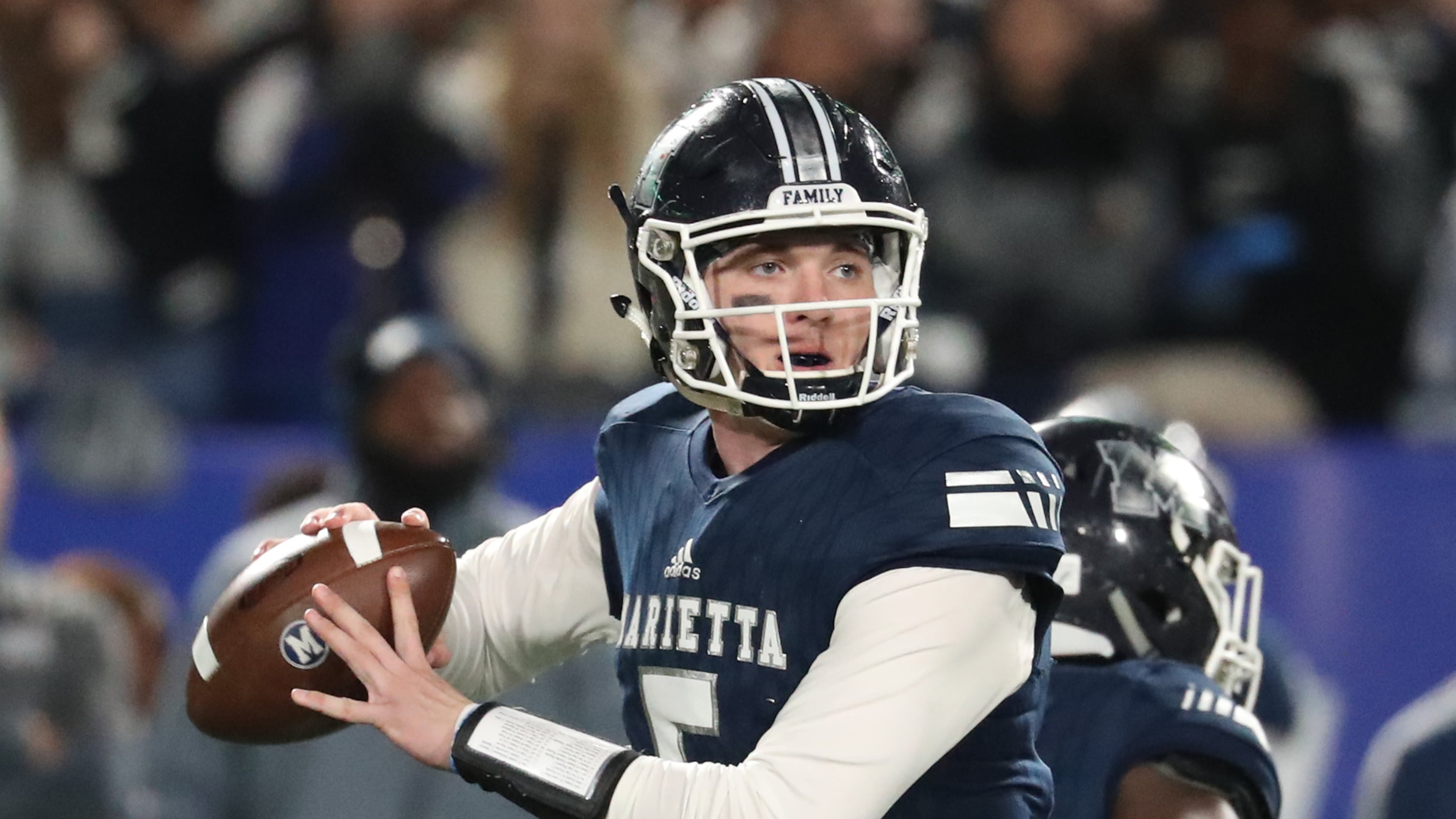 Marietta quarterback Harrison Bailey (5) attempts a pass in the first half against Lowndes during the Class AAAAAAA high school football state title game at Georgia State Stadium Saturday, December 14, 2019 in Atlanta. (JASON GETZ/SPECIAL TO THE AJC)