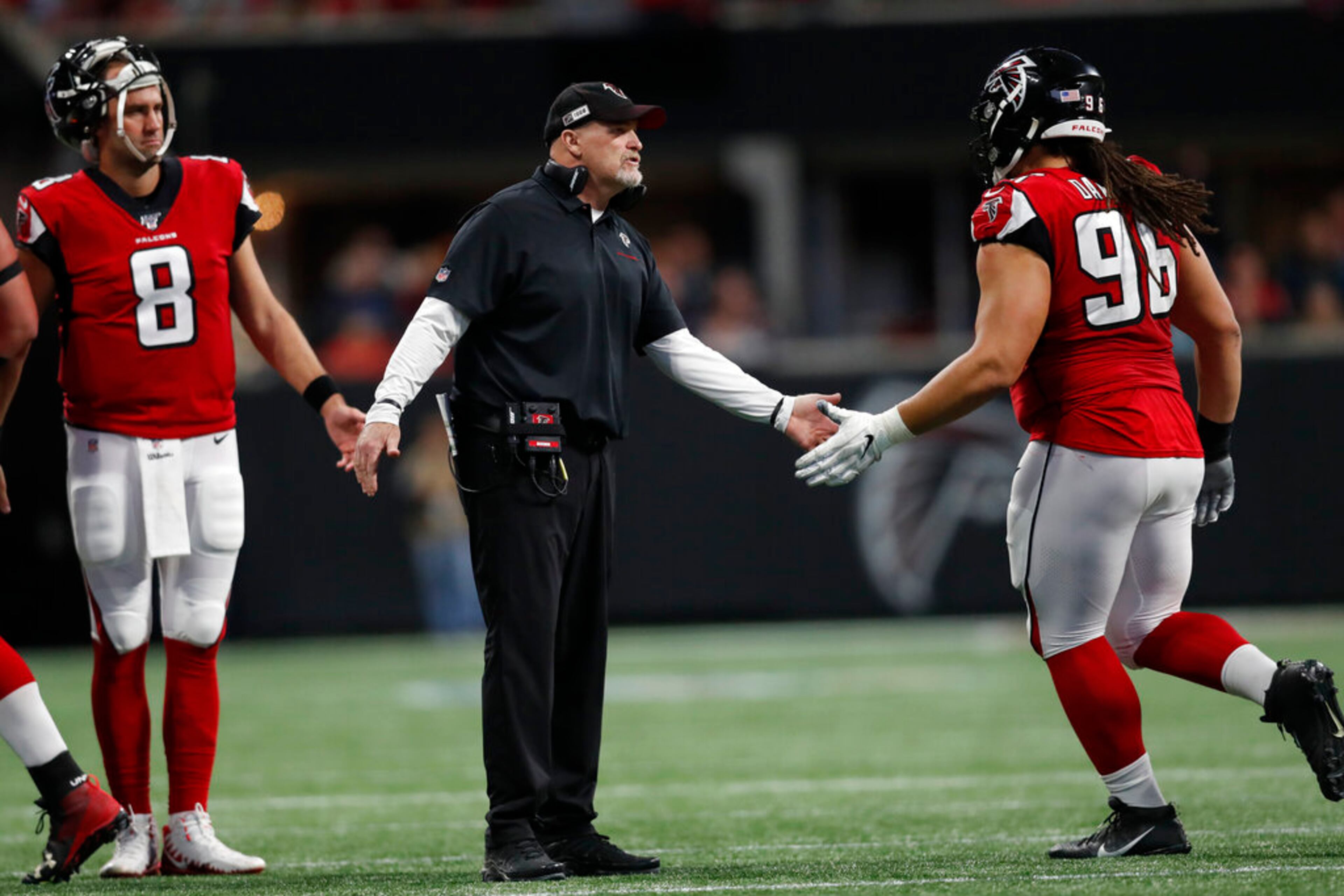 Falcons head coach Dan Quinn encourages players during the first half of an NFL football game against the Jacksonville Jaguars, Sunday, Dec. 22, 2019, in Atlanta. (AP Photo/John Bazemore)