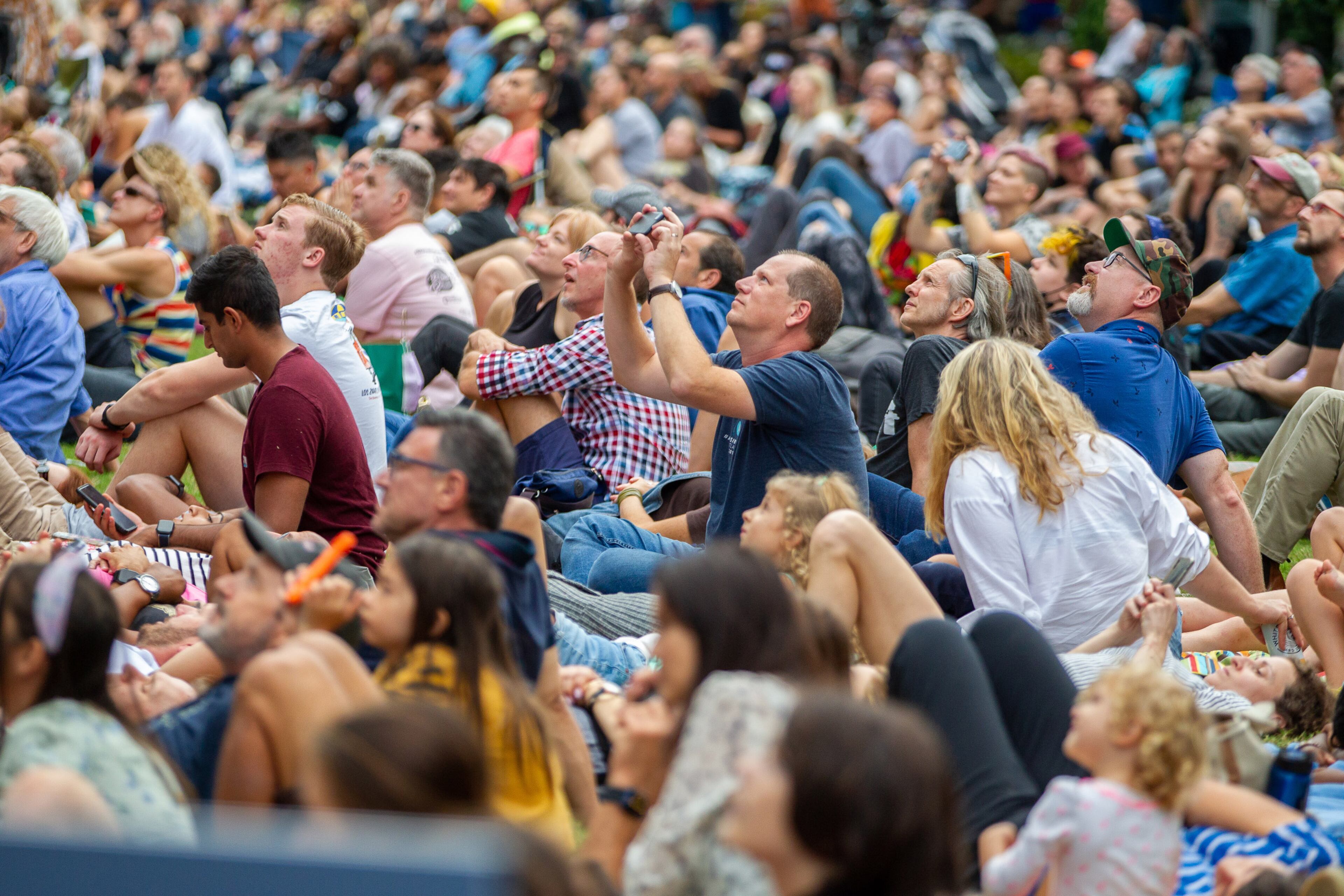 A crowd watches the Bandaloop dancers perform on the side of a building facing the Atlanta Beltline on Sunday, October 3, 2021. Celebrating its 30th season, Bandaloop transformed 725 Ponce de Leon Ave. (near Ponce City Market) into a vertical stage for the world premiere of “Field,” featuring spoken word and live music in addition to the troupe’s signature acrobatics. (Photo: Steve Schaefer for The Atlanta Journal-Constitution)