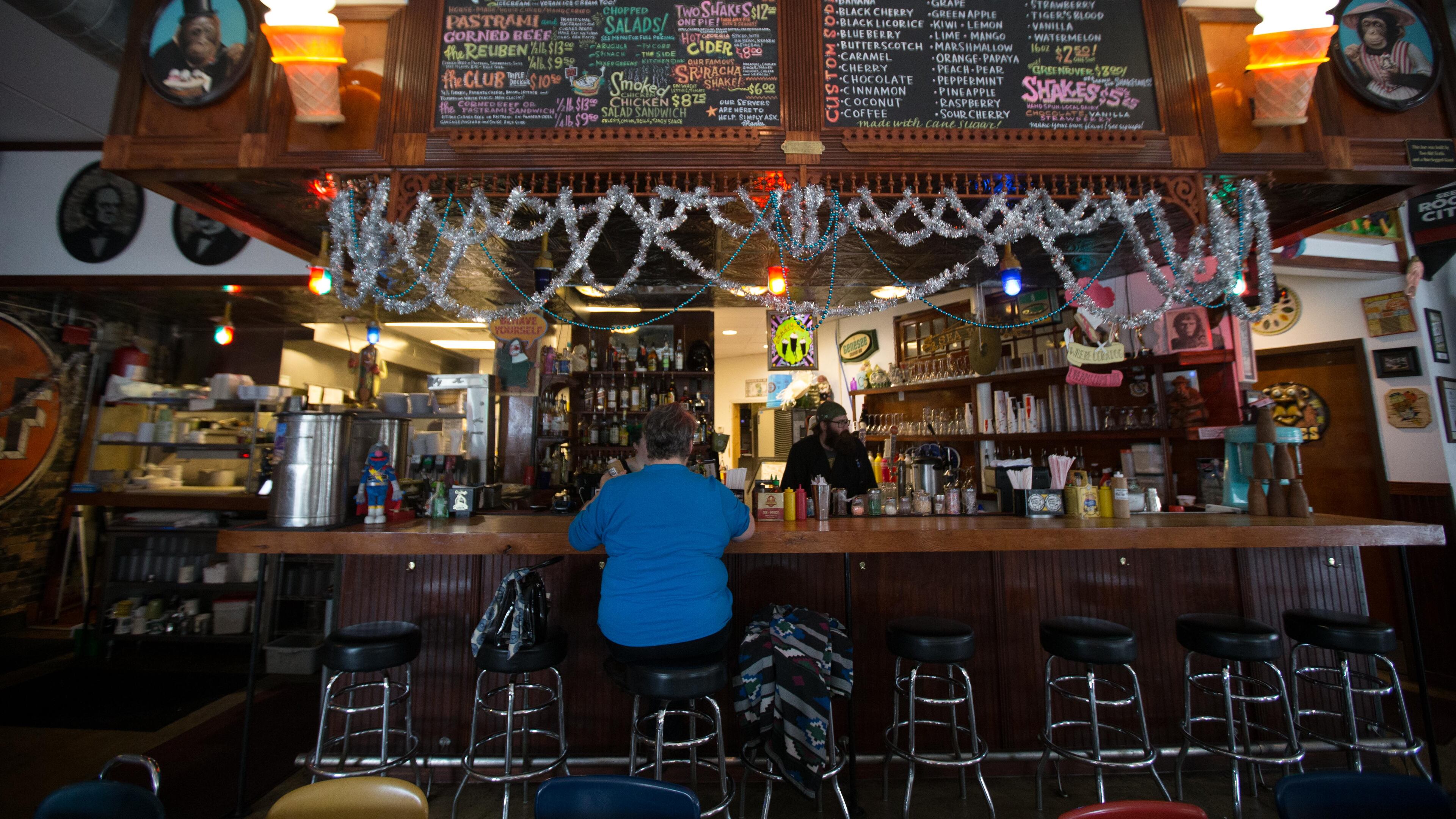 Marnie Bell-Ferguson eats lunch at Pallookaville Fine Foods, Dec. 14, 2015, in Avondale Estates. BRANDEN CAMP/SPECIAL