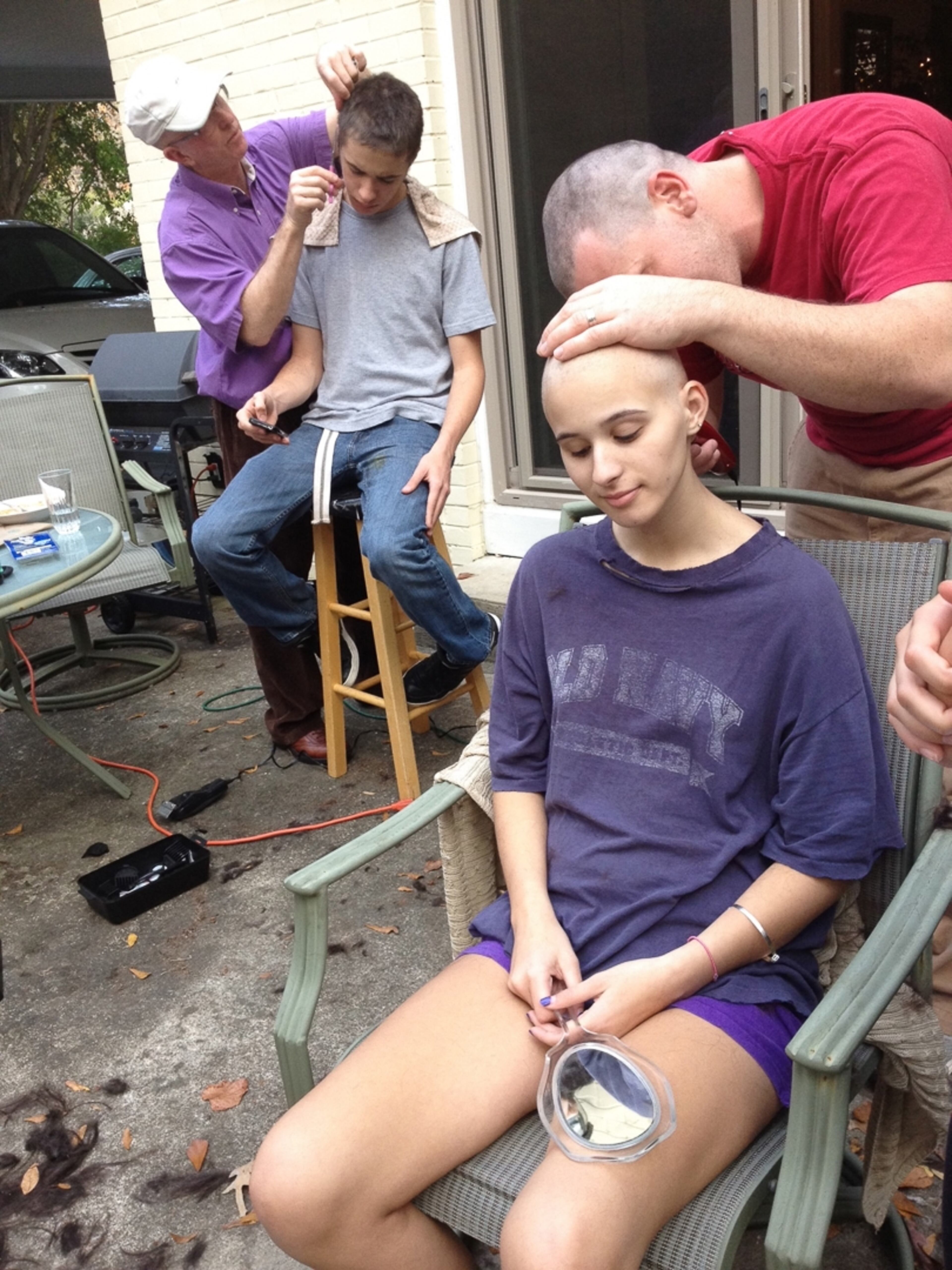 Summer's stepbrother, Jared Gentry, shaves her head while neighbor Steve Creel shaves Summer's twin brother, Jordan. It was a turning point in Summer's challenge.