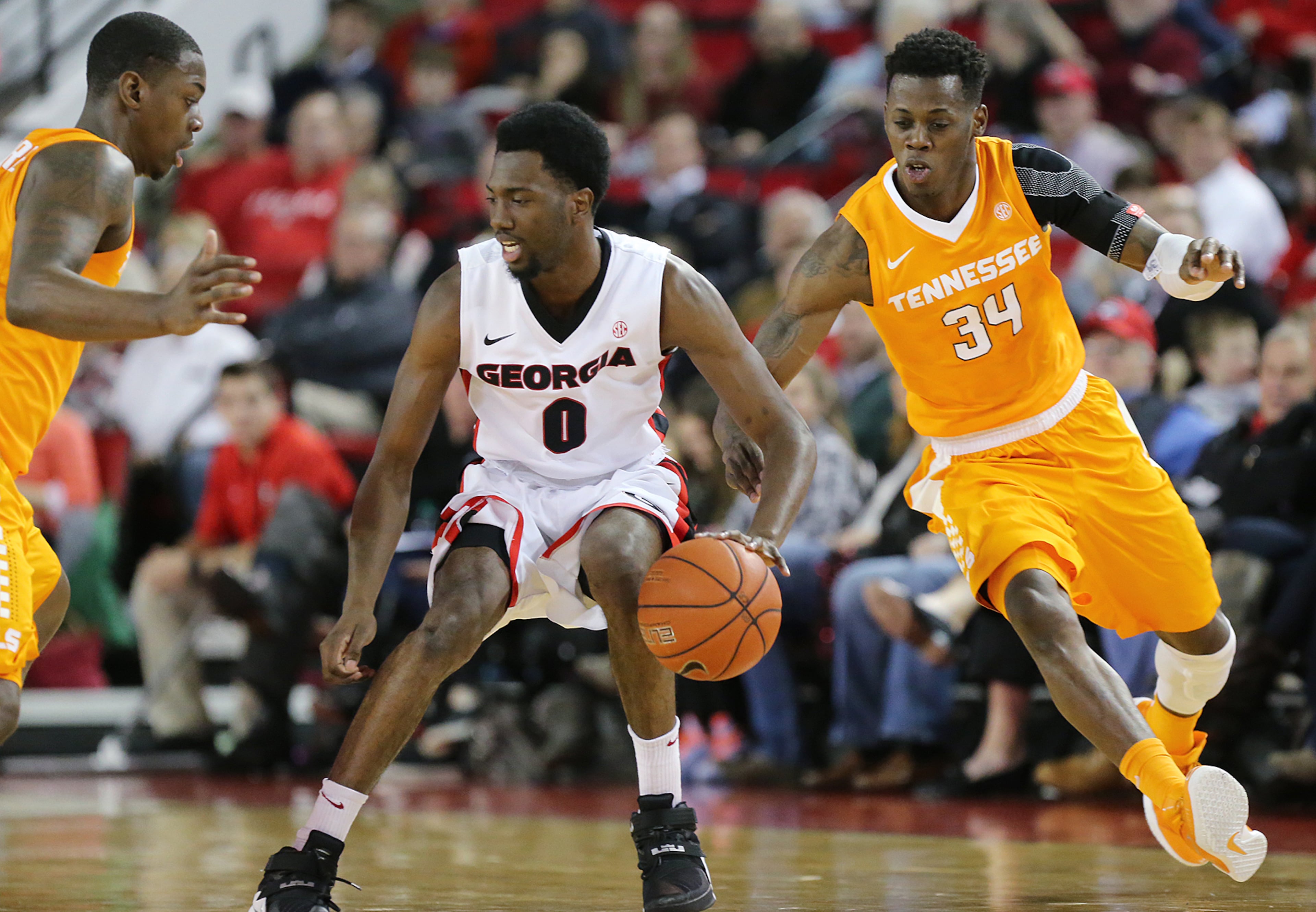 Tennessee guard Devon Baulkman comes in for the steal from behind Georgia guard William Jackson II during the first half in a basketball game on Wednesday, Jan. 13, 2016, in Athens. Curtis Compton / ccompton@ajc.com