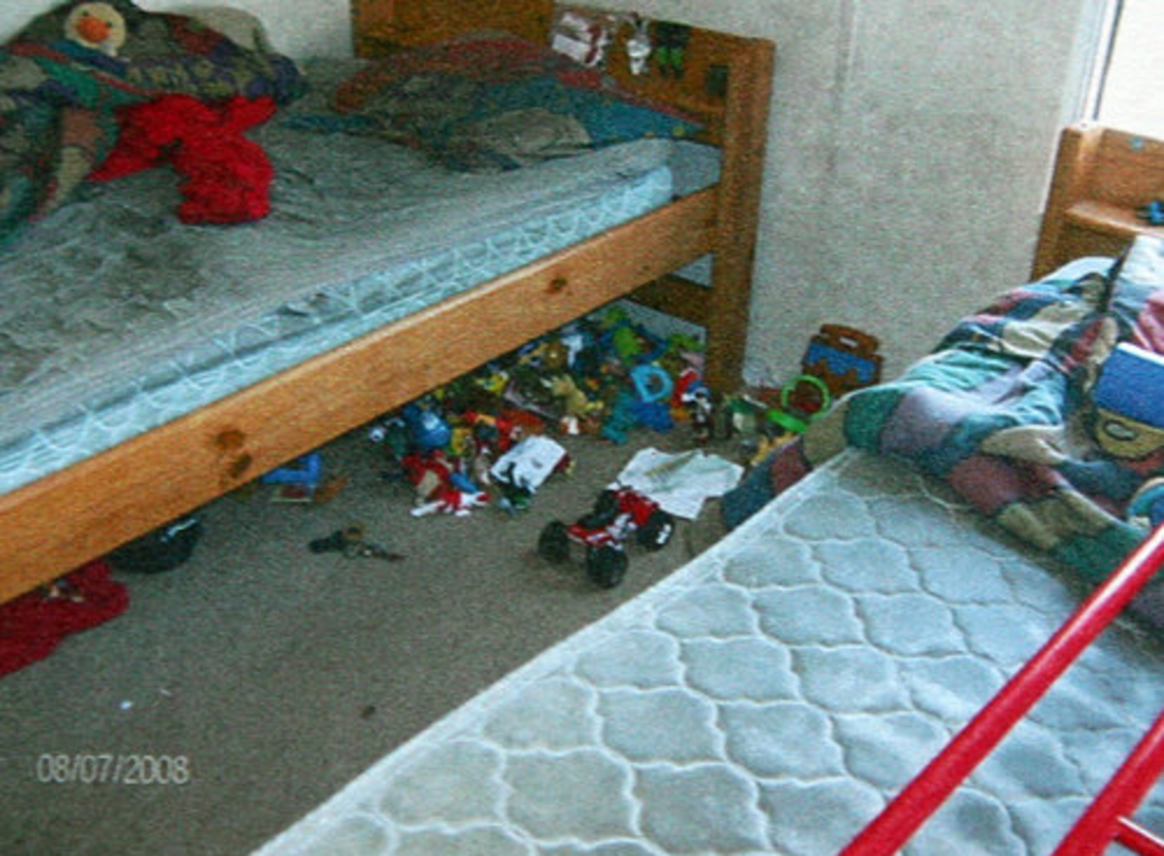 One bedroom contained evidence that children had slept there - discarded action figures, scribbled notes and pencils lay about.
