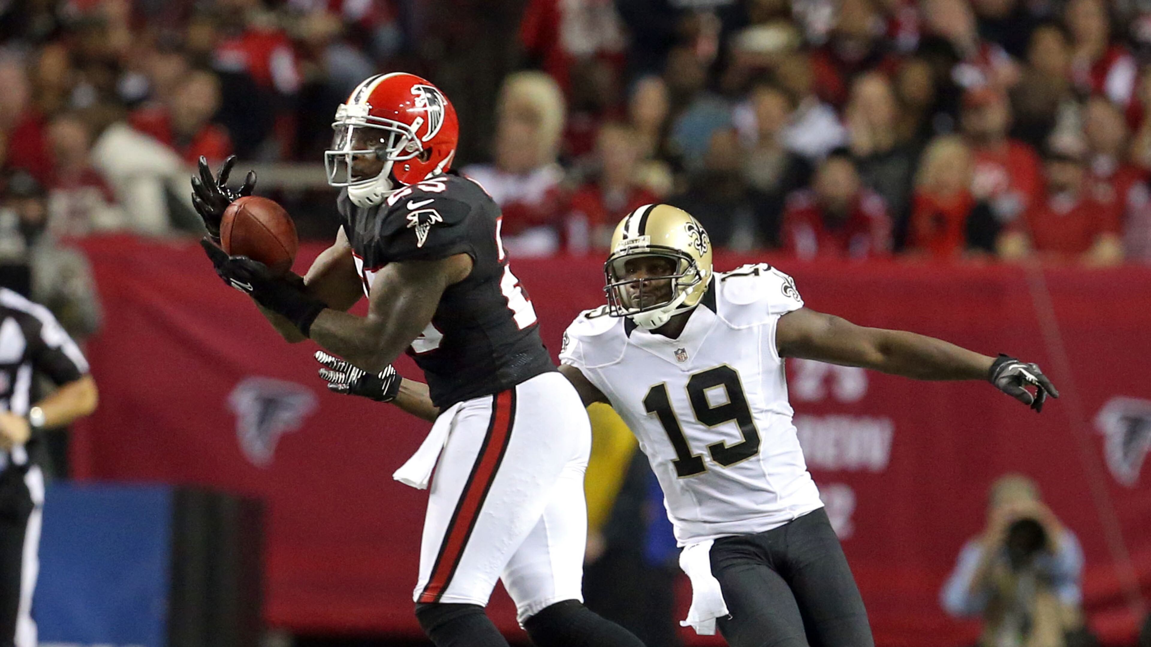 Falcons safety William Moore (25) steps in front of New Orleans wide receiver Devery Henderson (19) for an interception during the Falcons 23-13 win at the Georgia Dome Nov. 29, 2012.