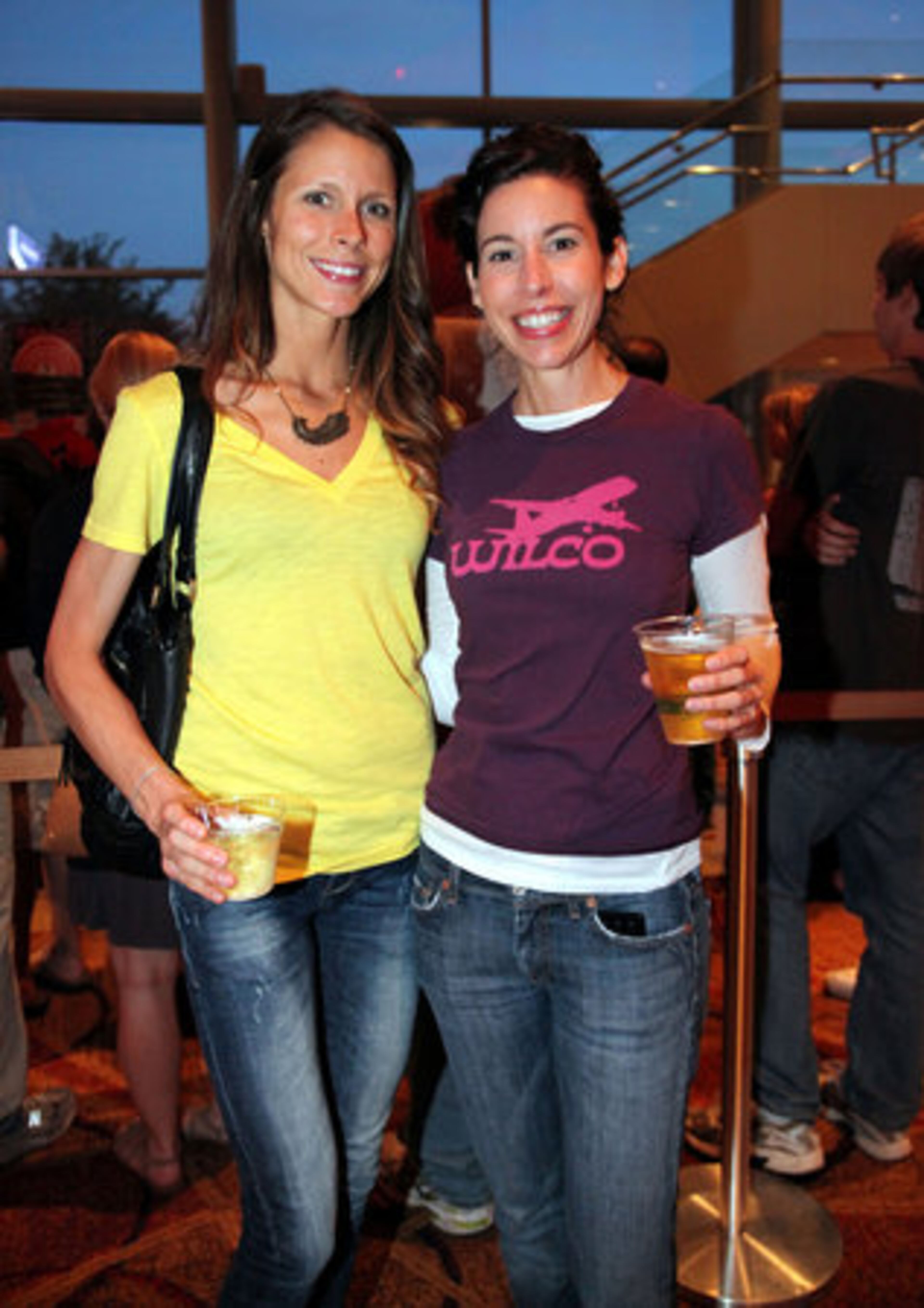 Whitney Appelgate(left) and Heather Goff, Vinings residents, get ready for the Wilco show at the Cobb Energy Centre.