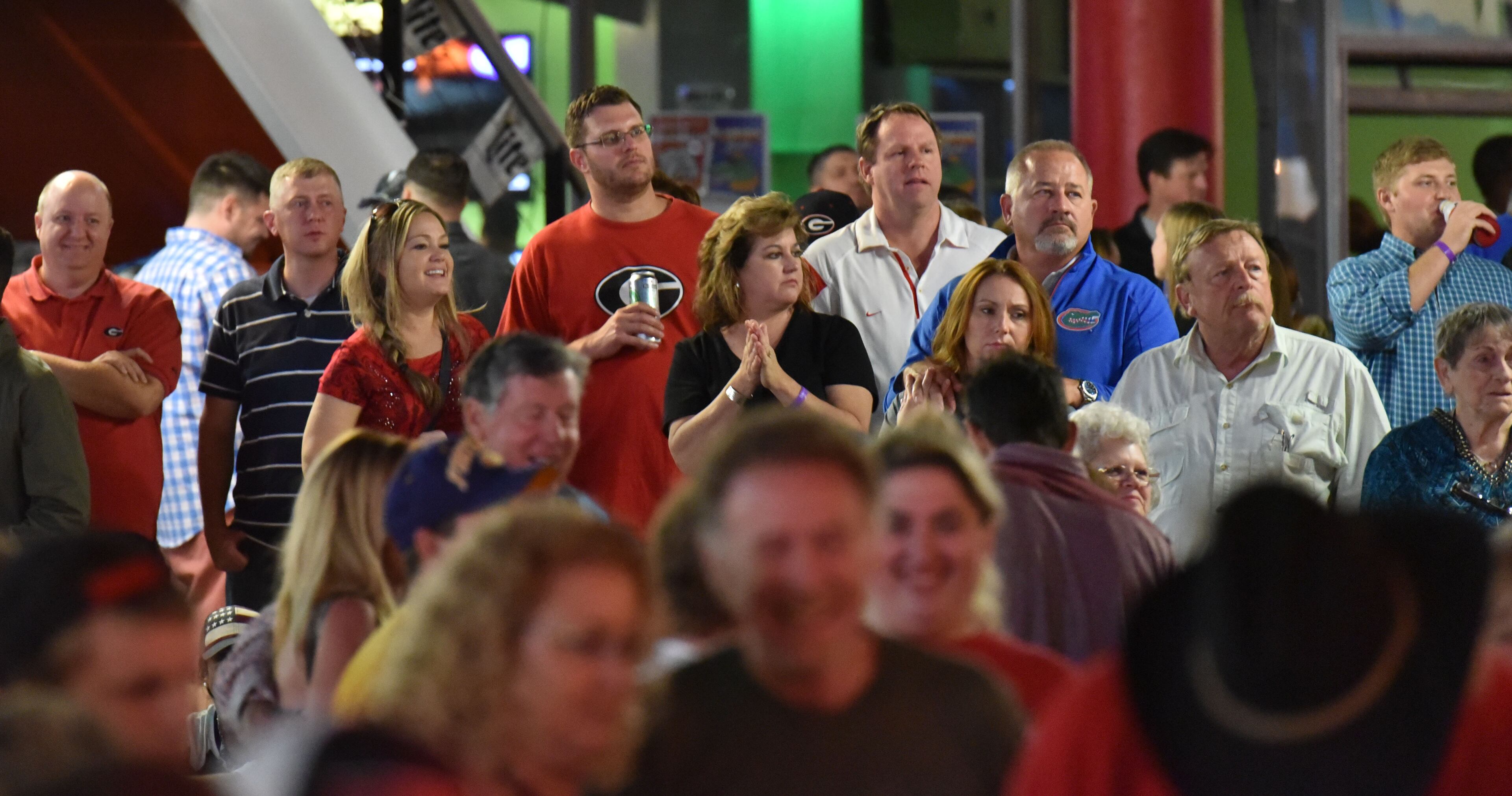 October 30, 2015 Jacksonville, Florida - Georgia and Florida fans gather to celebrate during an annual party at the Jacksonville Landing on the eve of the Georgia - Florida game on Friday, October 30, 2015. HYOSUB SHIN / HSHIN@AJC.COM