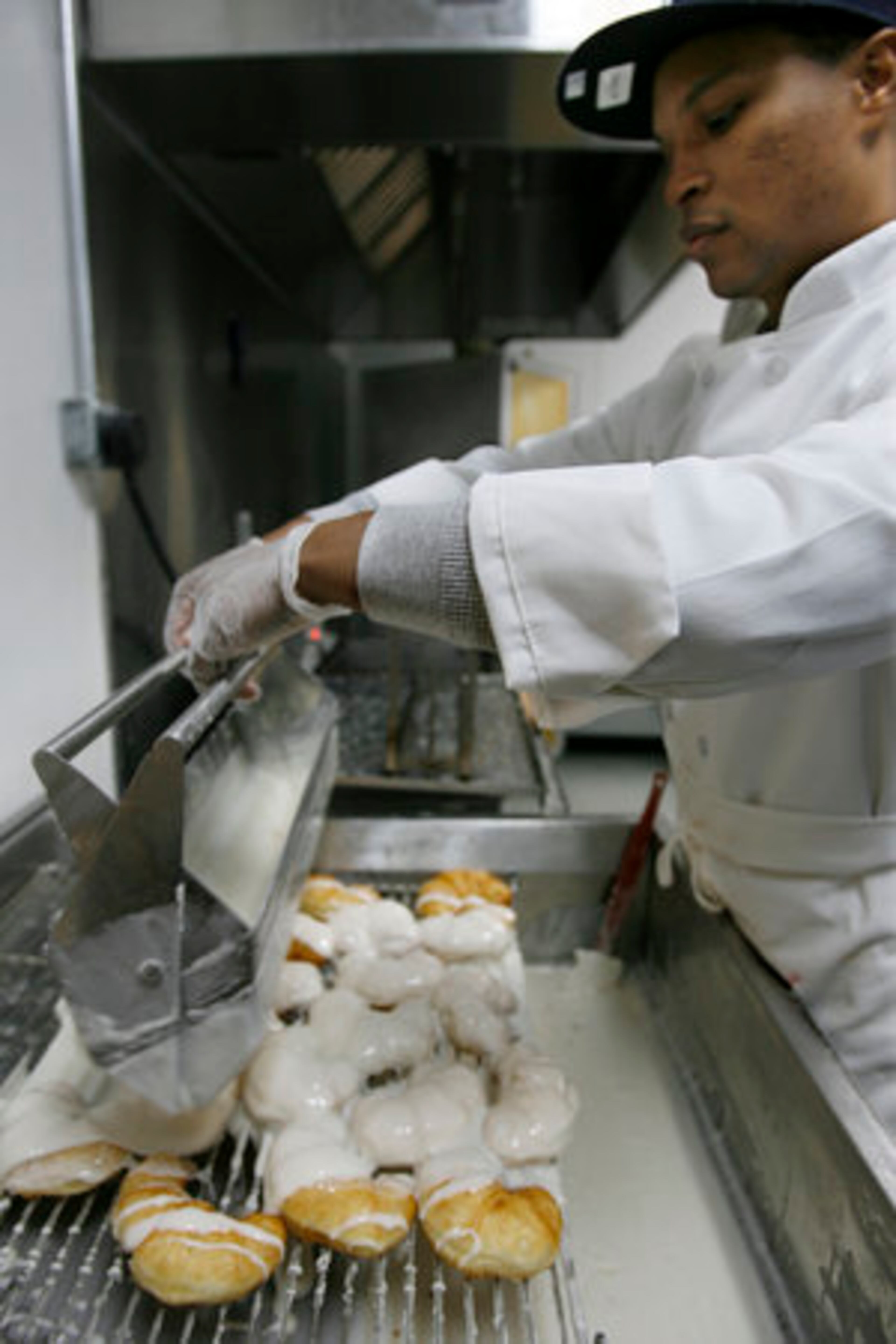 Then applies the glaze.