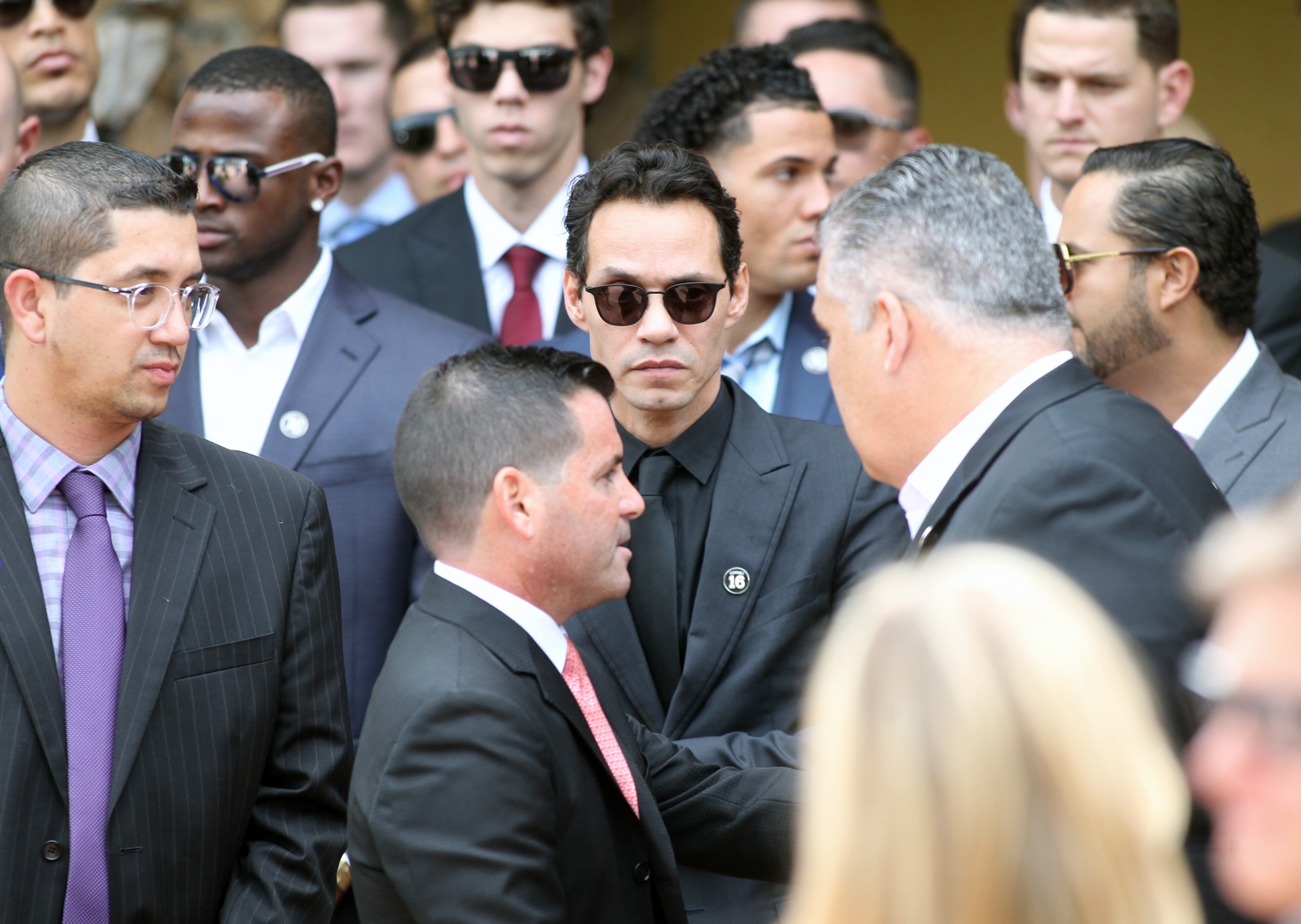 Singer Marc Anthony, center, and Miami Marlins team president David Samson after the memorial service for Marlins pitcher Jose Fernandez at St. Brendan Catholic Church in Miami on Thursday, Sept. 29, 2016. (Roberto Koltun/El Nuevo Herald/TNS)
