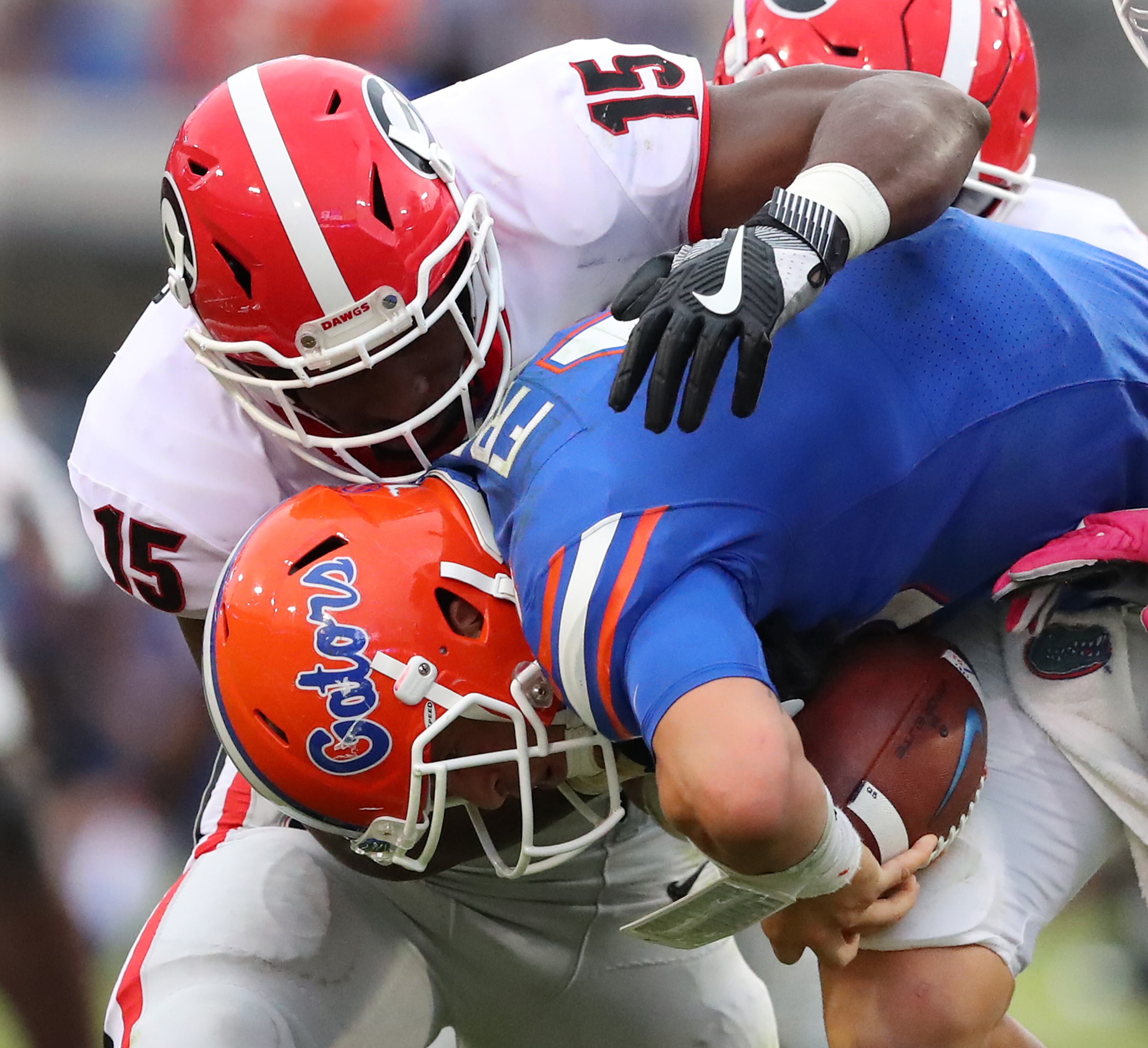 October 28, 2017 Jacksonville: Georgia linebacker DâAndre Walker sacks Florida quarterback Feleipe Franks during the second half in NCAA college football game on Friday, October 27, 2017, in Jacksonville. Georgia beat Florida 42-7. Curtis Compton/ccompton@ajc.com