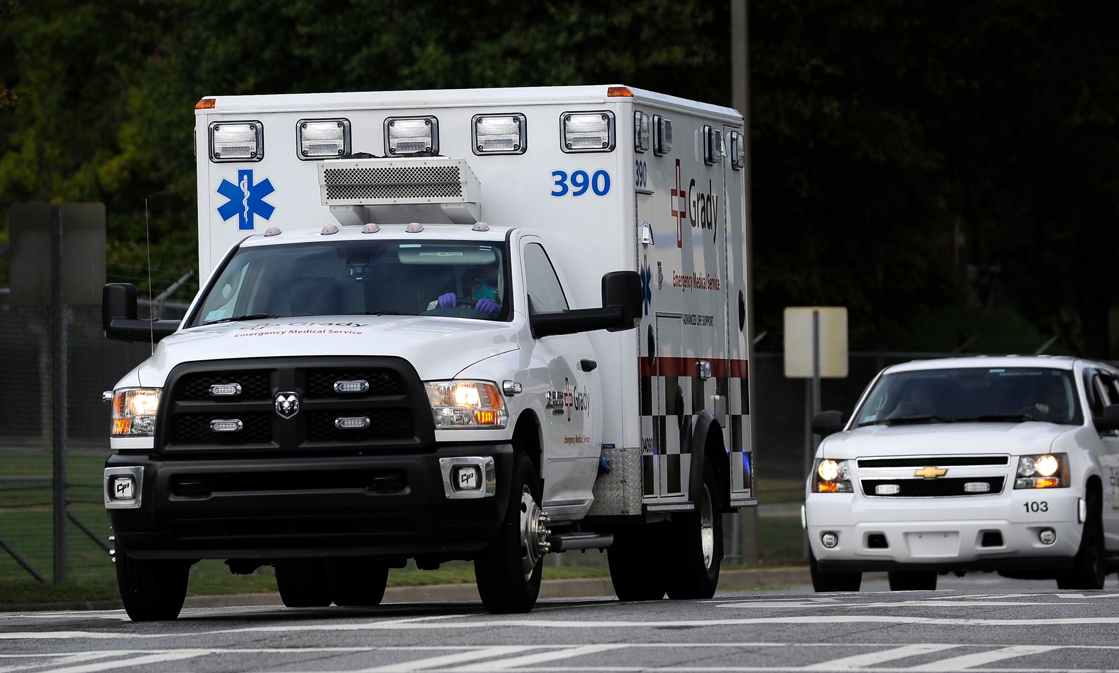 An ambulance transporting an American infected with the deadly Ebola virus from West Africa, leaves Dobbins Air Reserve Base Tuesday, Sept. 9, 2014 in Marietta, Ga., for Emory University Hospital in Atlanta. A joint emergency isolation unit administered by Emory University Hospital and the Centers for Disease Control and Prevention successfully treated two Americans last month in Atlanta. (AP Photo/David Tulis)