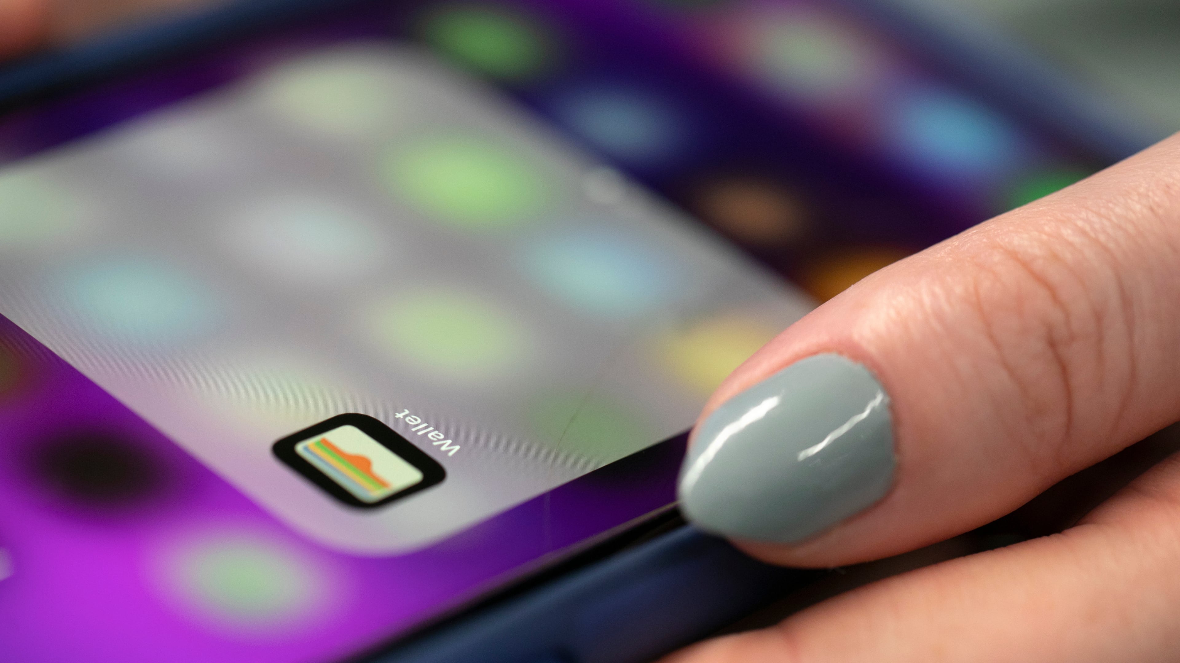 FILE - A person uses an iPhone on Oct. 8, 2019 in New York. ne models and later some Mac computers to get access to genuine Apple parts and tools to be able to repair them. (AP Photo/Jenny Kane, File)