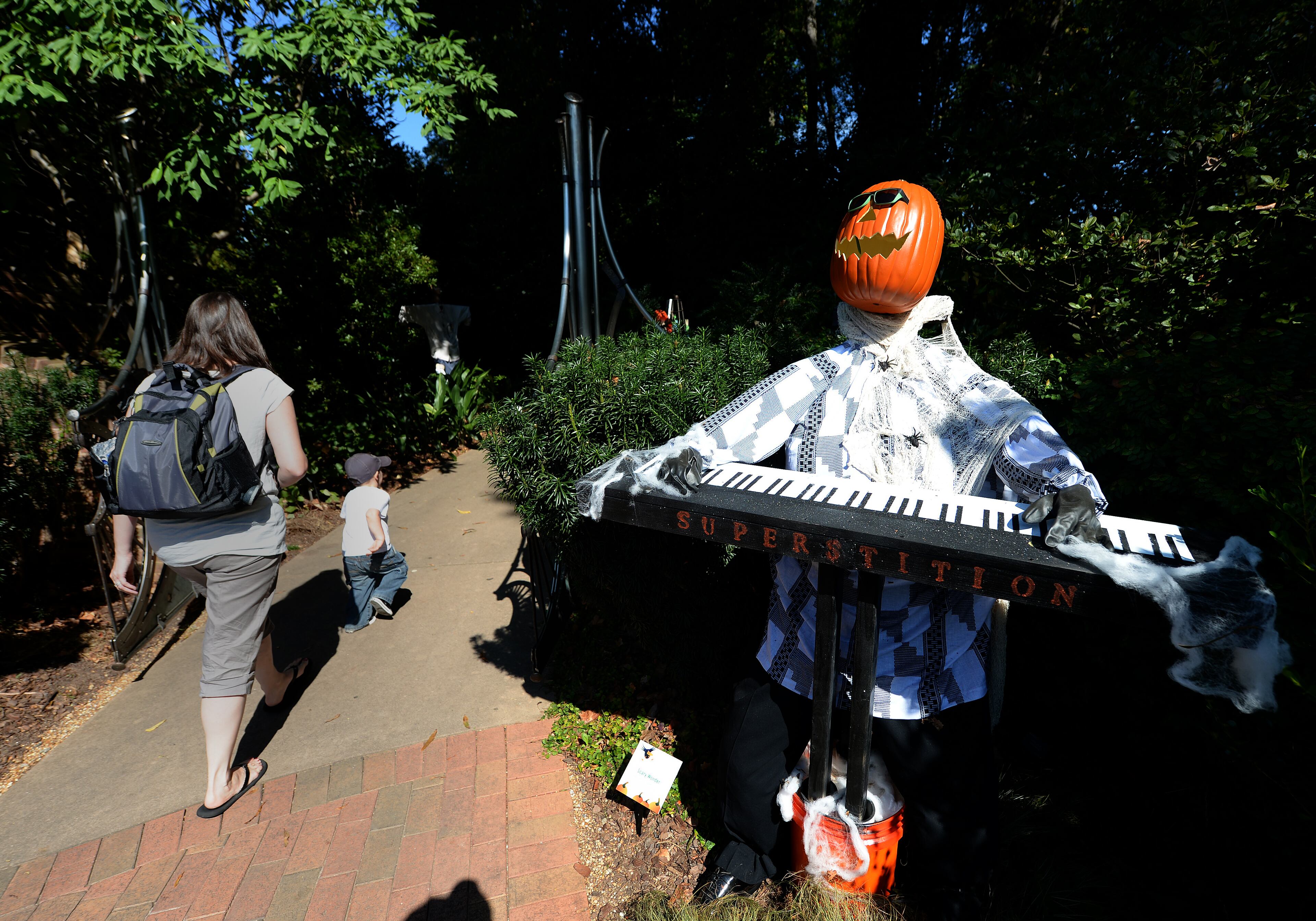 Scary Wonder greets people at the Atlanta Botanical Garden on Wednesday, October 2, 2013. This was one of over 125 scarecrows hand crafted by businesses, individuals, schools and organizations. The creative scarecrows share the stage with the larger than life plant creatures of Imaginary Worlds. JOHNNY CRAWFORD / JCRAWFORD@AJC.COM JOHNNY CRAWFORD / JCRAWFORD@AJC.COM