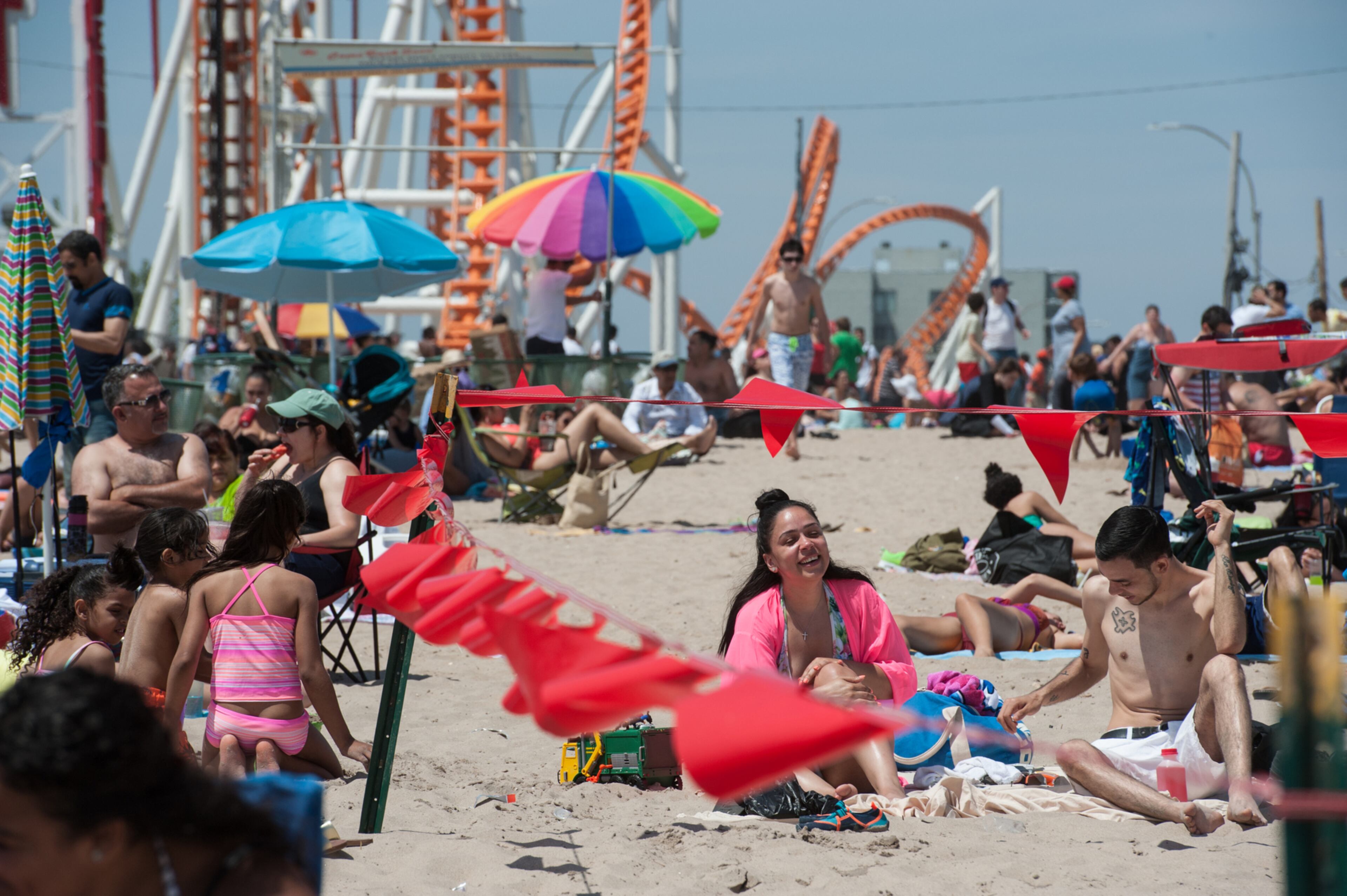 DAY AT THE BEACH--NEW YORK, NY - MAY 29: People enjoy a day at the beach in Coney Island on May 29, 2016 in the Brooklyn borough of New York City. New York City is experiencing higher than average temperatures for the holiday weekend. (Photo by Stephanie Keith/Getty Images)