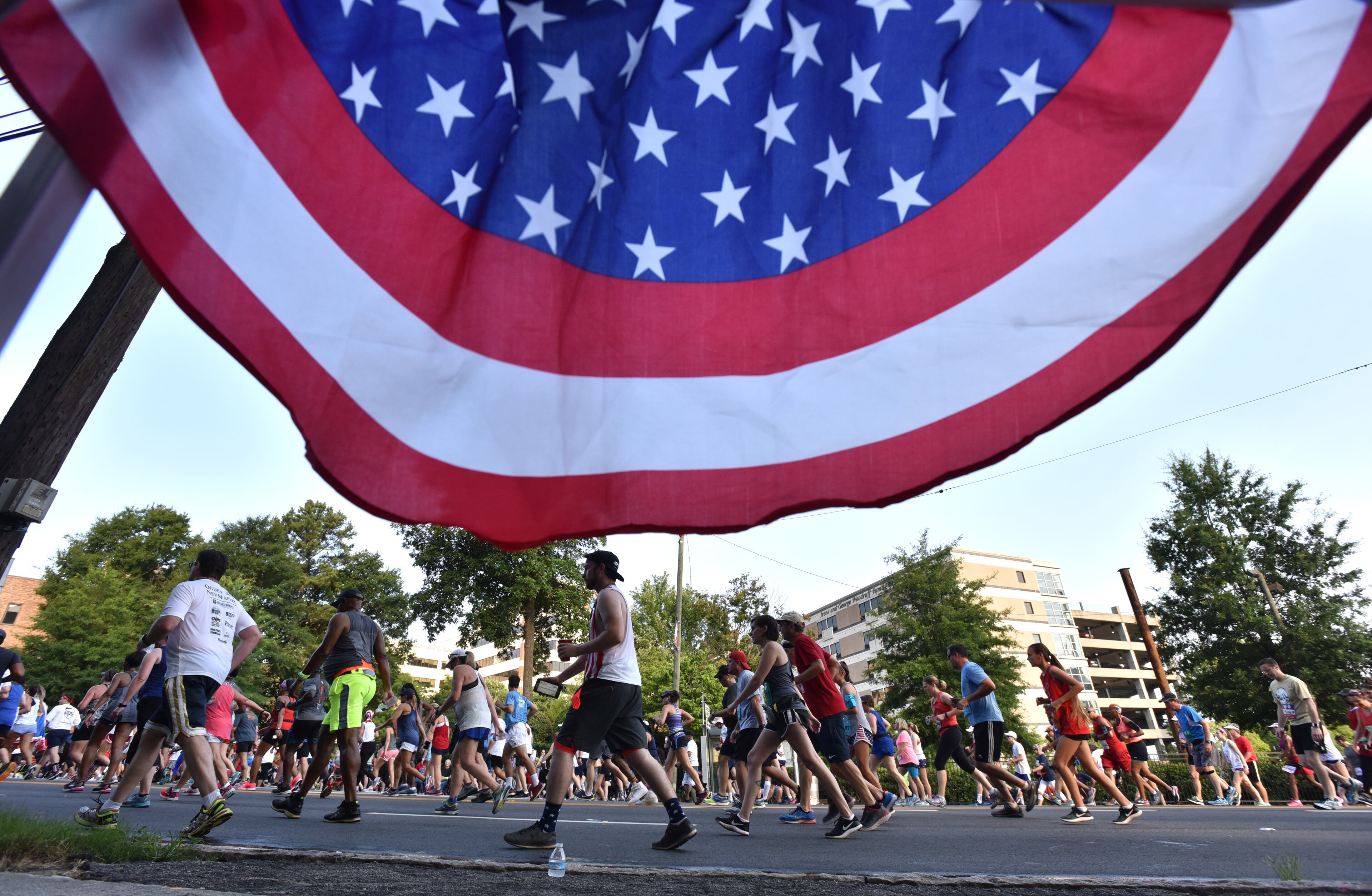 July 4, 2018 Atlanta - Runners approach Cardiac Hill during the AJC Peachtree Road Race on Wednesday, July 4, 2018. HYOSUB SHIN / HSHIN@AJC.COM