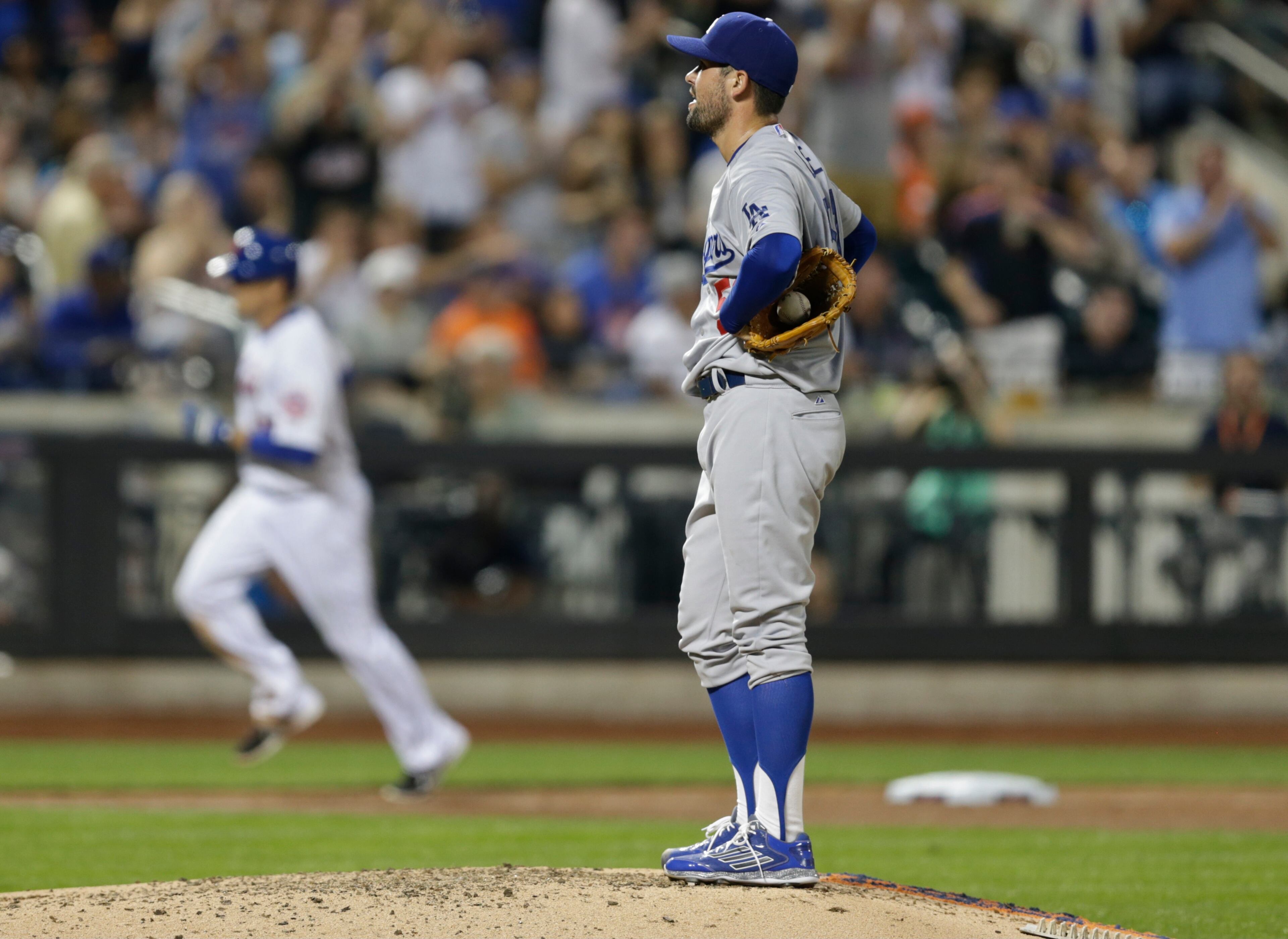 Los Angeles Dodgers pitcher Zach Lee reacts as New York Mets' Kelly Johnson (55) heads toward home plate after hitting a home run during the fifth inning of a baseball game Saturday, July 25, 2015, in New York. (AP Photo/Frank Franklin II)
