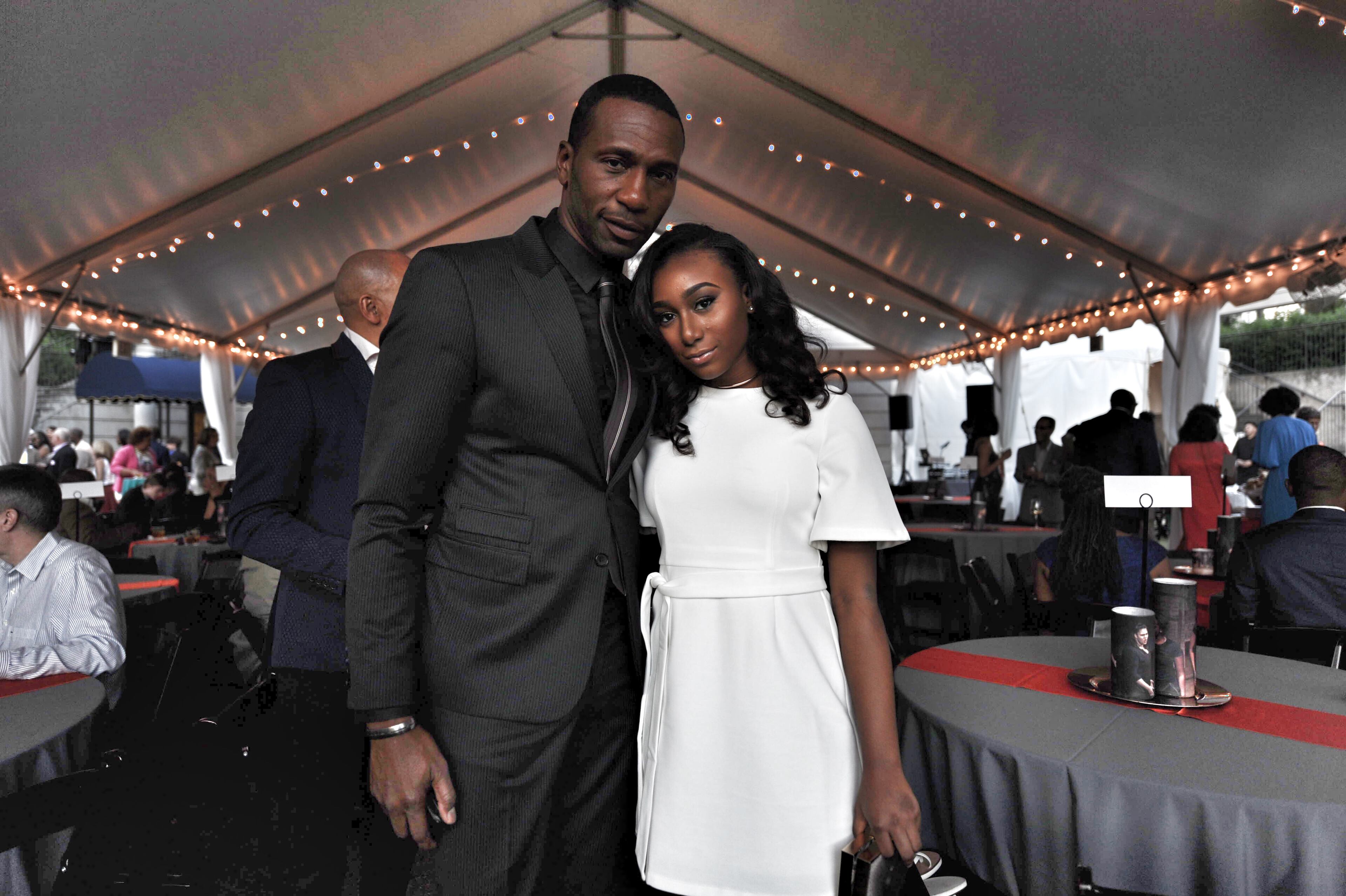 At the Millenium Gate Museum at Atlantic Station following the daytime golf tournament that accompanies the event every year, actor Leon Robinson and daughter, Noelle Robinson strike a pose.