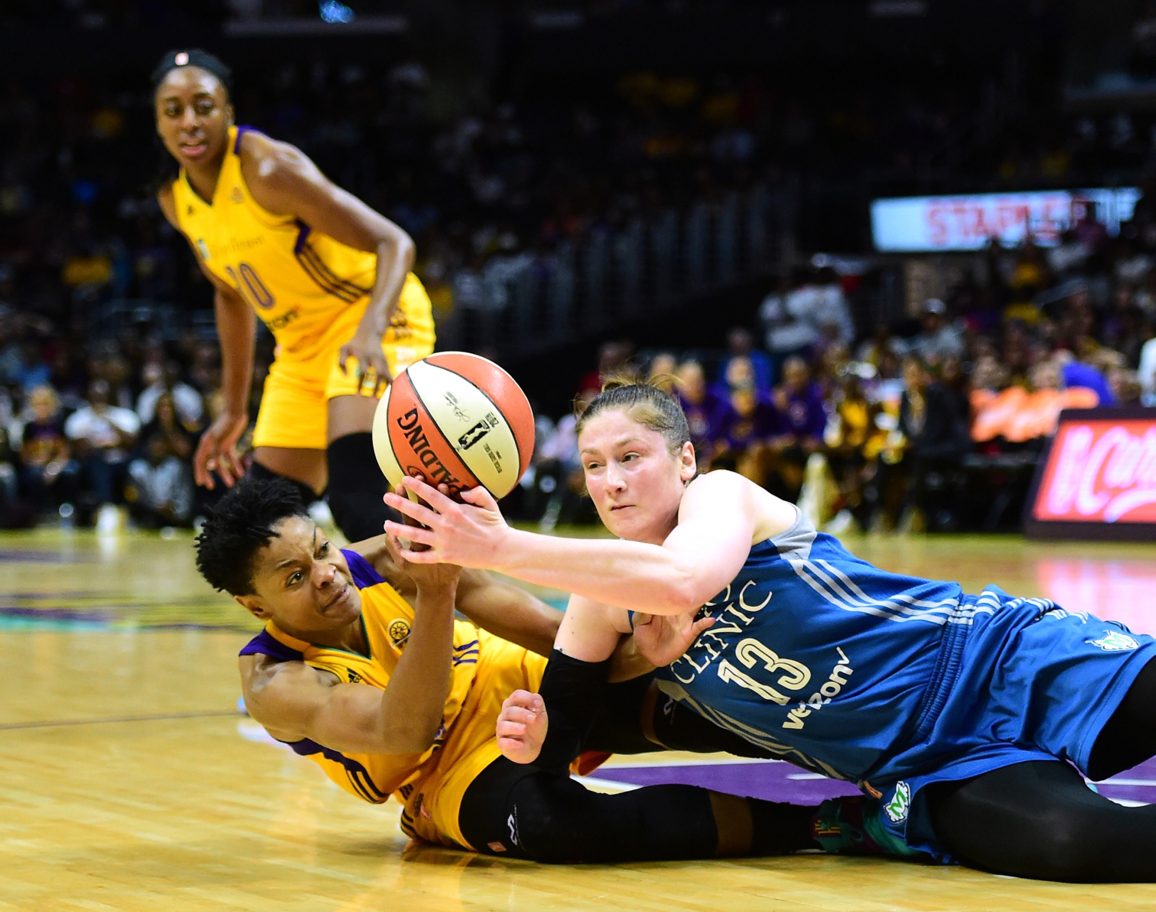 LOS ANGELES, CA - OCTOBER 16: Guard Lindsay Whalen #13 of the Minnesota Lynx and guard Alana Beard #0 of the Los Angeles Sparks dive for a ball in front of forward Nneka Ogwumike #30 at Staples Center on October 16, 2016 in Los Angeles, California. NOTE TO USER: User expressly acknowledges and agrees that, by downloading and or using this photograph, User is consenting to the terms and conditions of the Getty Images License Agreement. (Photo by Harry How/Getty Images) *** BESTPIX ***
