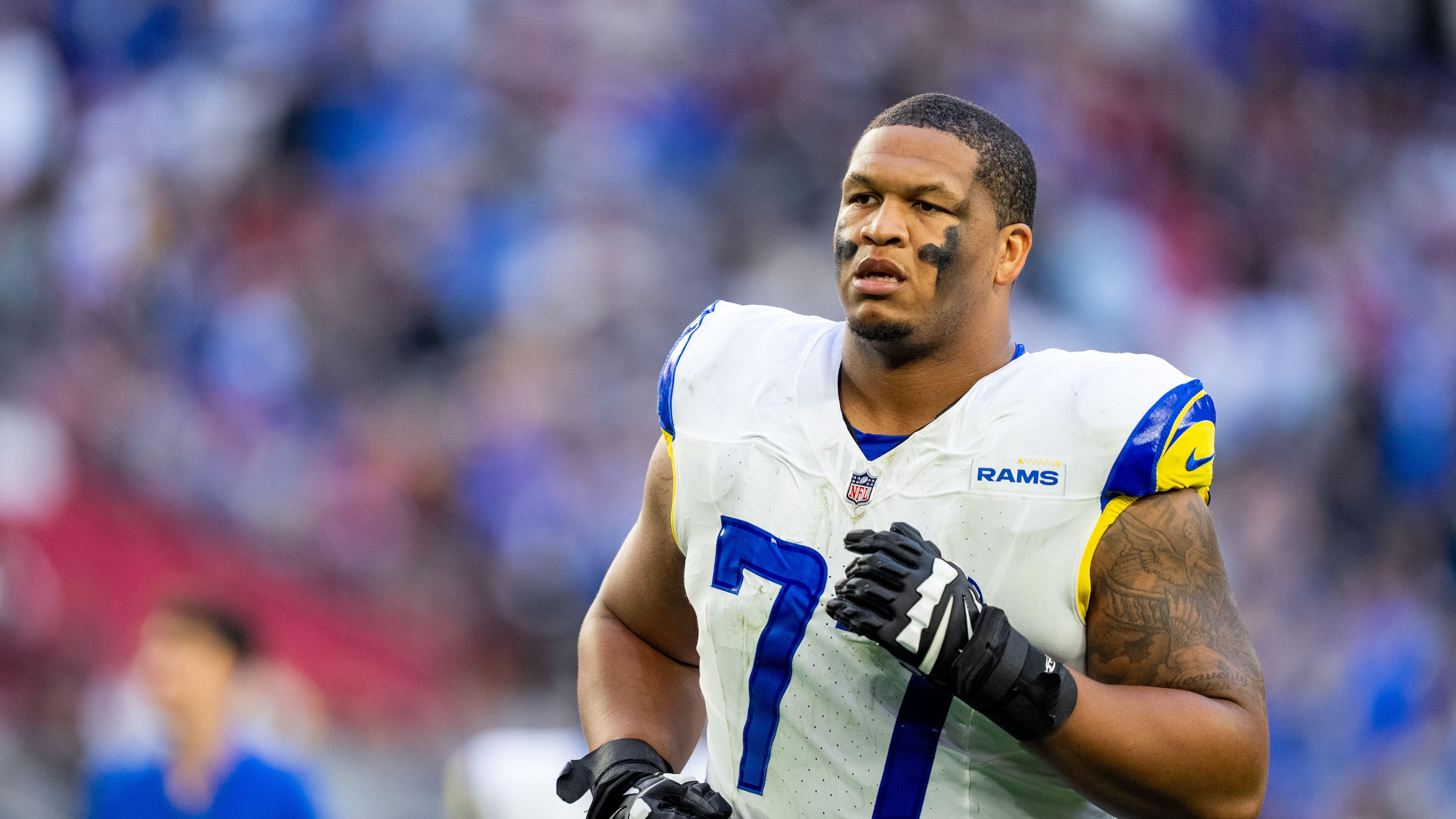 FILE - Los Angeles Rams offensive tackle Alaric Jackson (77) runs off the field at halftime during an NFL football game against the Arizona Cardinals, Dec. 7, 2025, in Glendale, Ariz. (AP Photo/Samantha Chow, File)