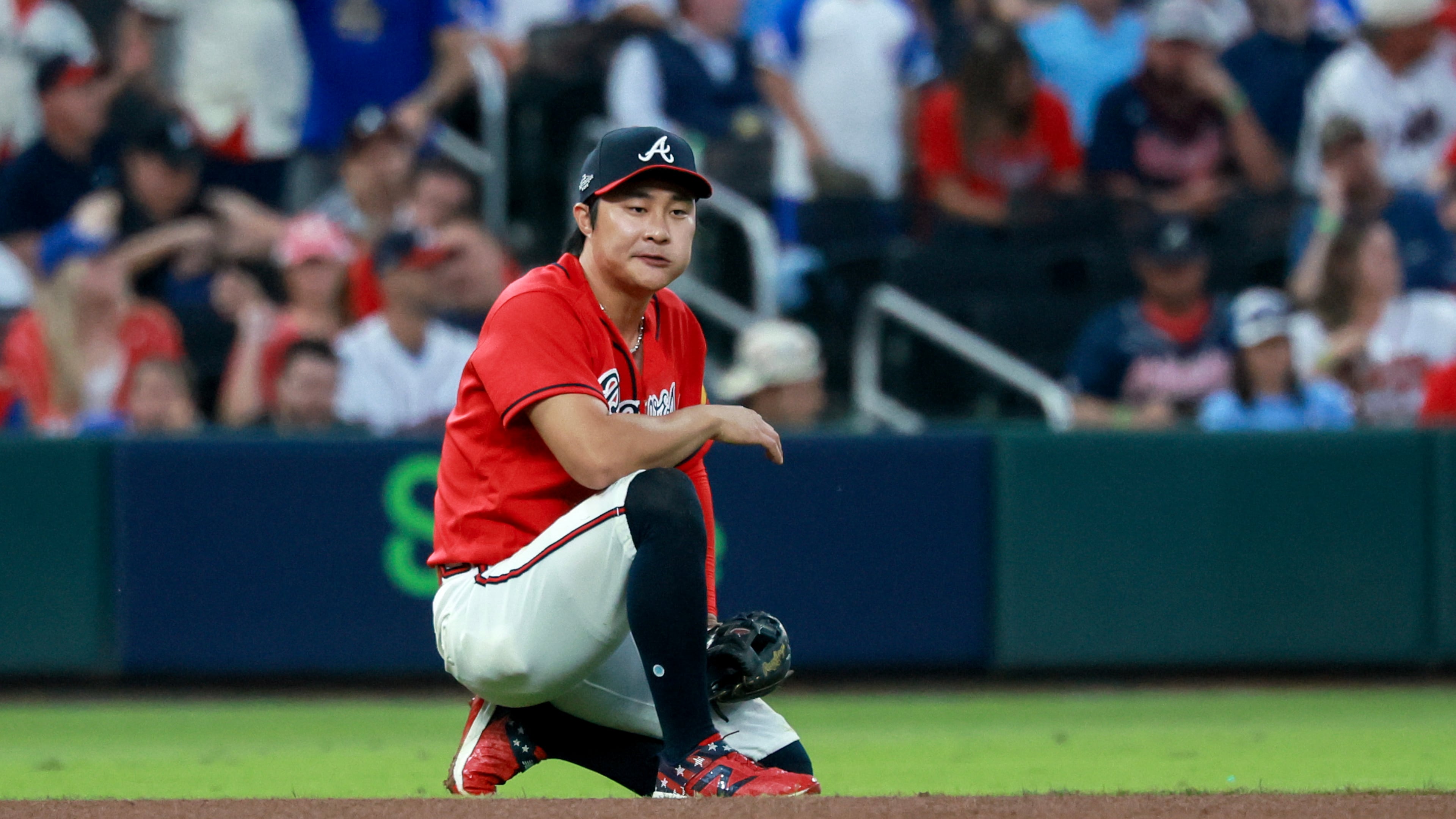 Atlanta Braves shortstop Ha-Seong Kim (7) reacts after a Los Angeles Dodgers' Mookie Betts got a hit past him during the third inning of Game 3 of the MLB National League Division Series between the Atlanta Braves and the Los Angeles Dodgers, Tuesday, Oct. 6, 2026, in Atlanta. (Jason Getz/AJC)