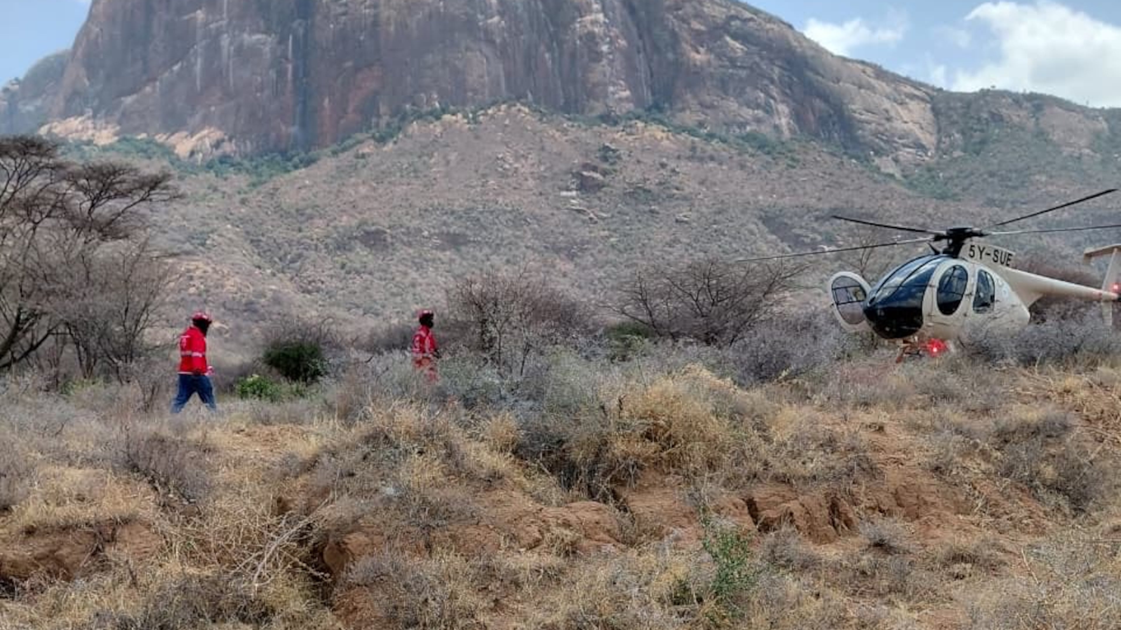 This photo provided by Kenya Red Cross shows Kenya Red Cross emergency response teams during a multi-agency rescue and recovery operation in response to a helicopter crash near Mt. Ololokwe in Samburu, Kenya, Wednesday, Aug. 19, 2026. (Kenya Red Cross via AP) ADDITION: Removes reference to killed tourists