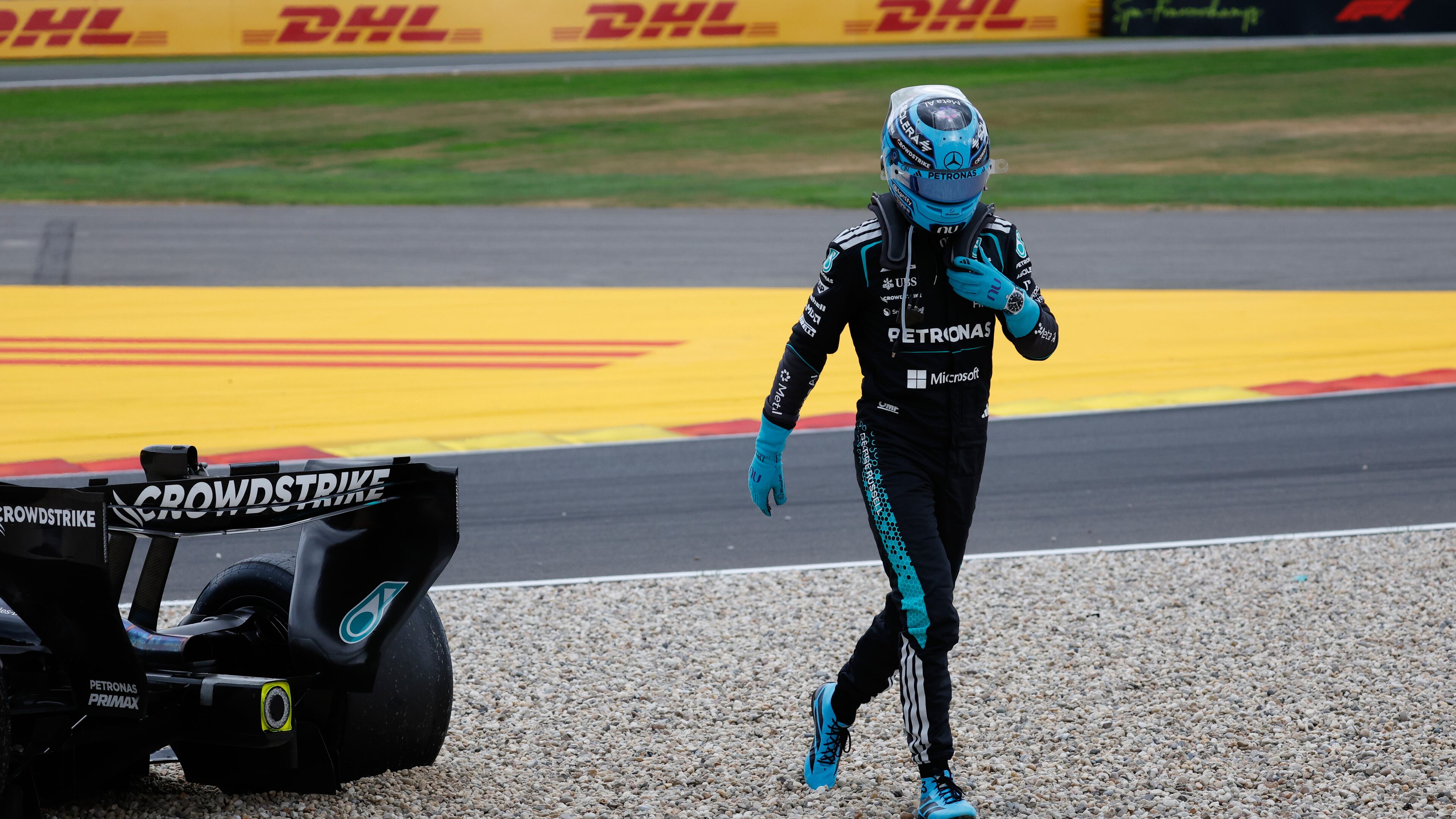 Mercedes driver George Russell of Britain gets out of his car after going off the track during the Formula One Grand Prix at the Spa-Francorchamps racetrack in Spa, Belgium, Sunday, July 19, 2026. (AP Photo/Geert Vanden Wijngaert)
