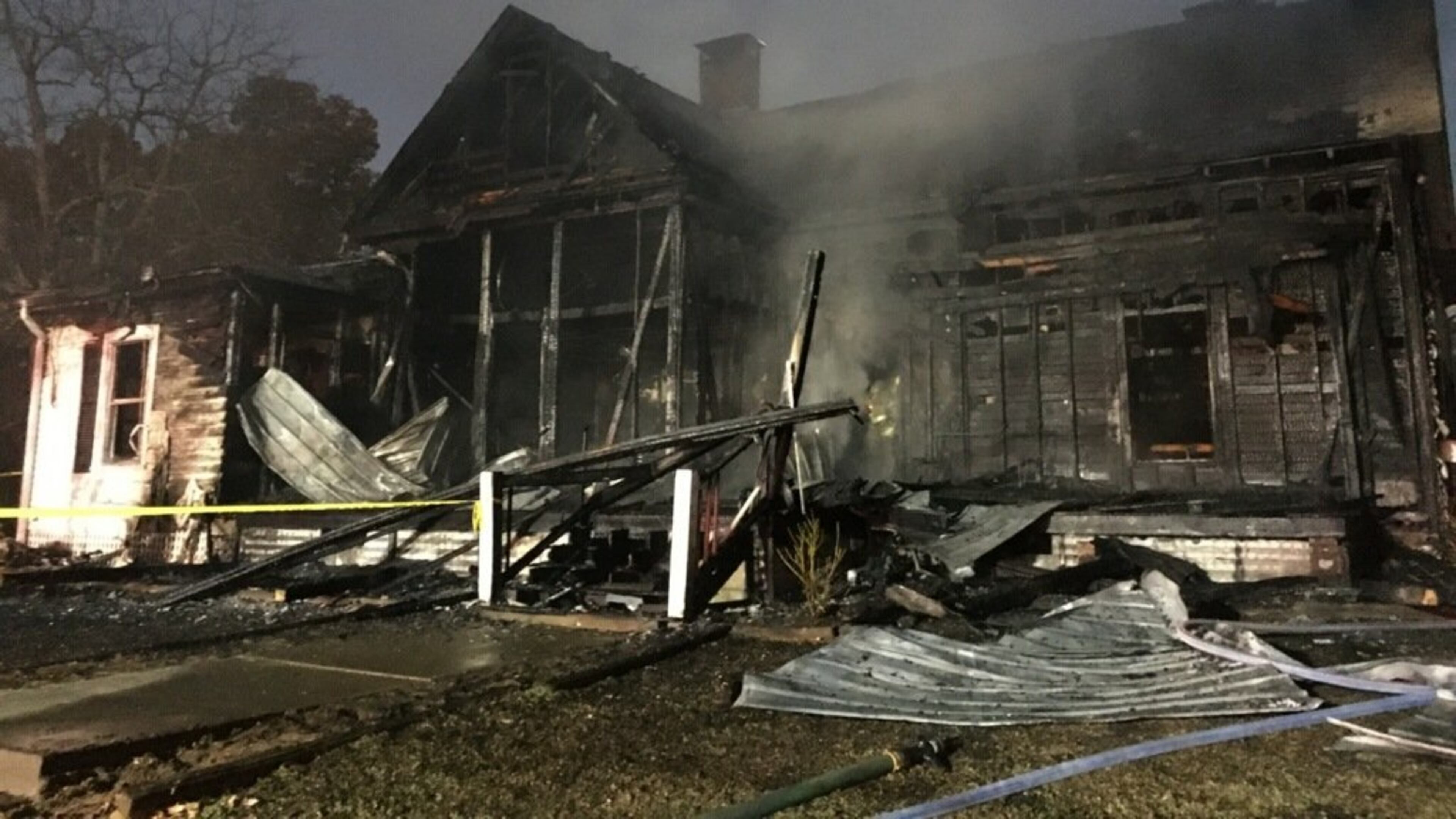 A burning cigarette sparked an early morning fire that destroyed a Buford home and killed the family's pet cat, authorities said Saturday.