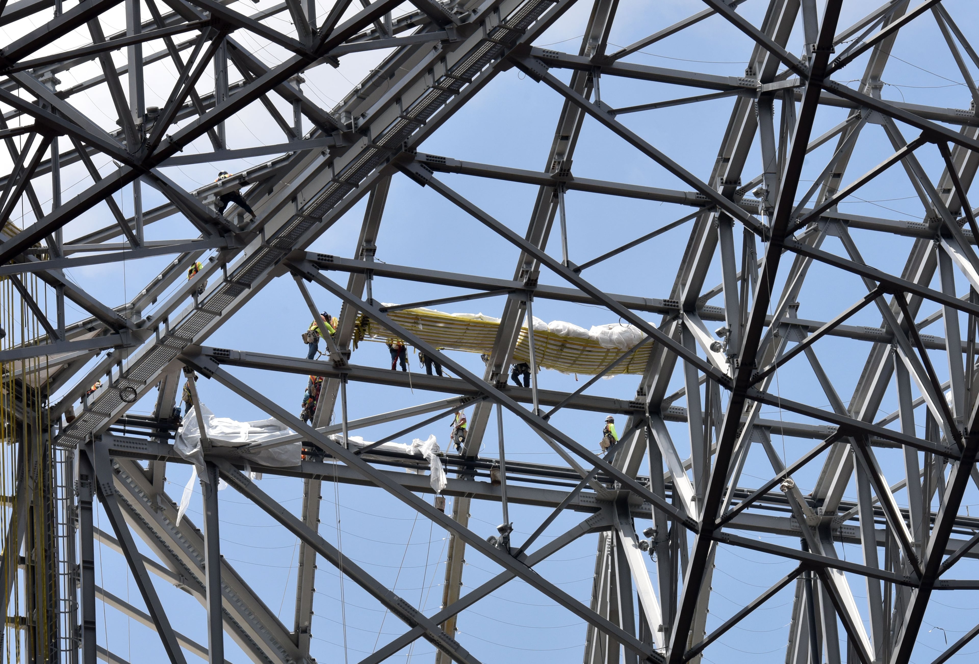 June 15, 2017 Atlanta - Construction crews work on the retractable roof during a media tour of Mercedes-Benz Stadium on Thursday, June 15, 2017. HYOSUB SHIN / HSHIN@AJC.COM