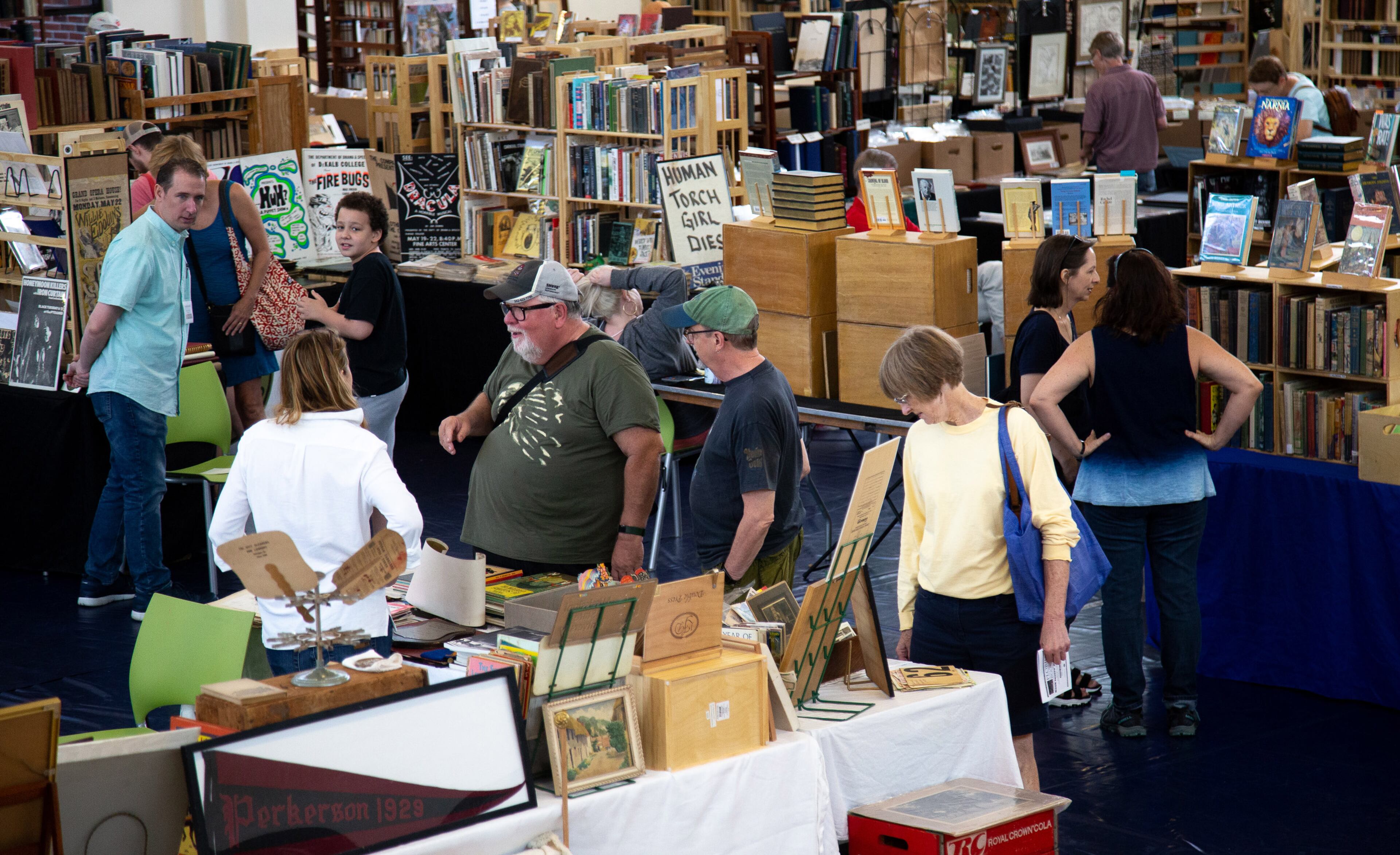 People look over the books at the Georgia Book and Paper Fair during the AJC Decatur Book Festival on Sunday, September 1, 2019. STEVE SCHAEFER / SPECIAL TO THE AJC