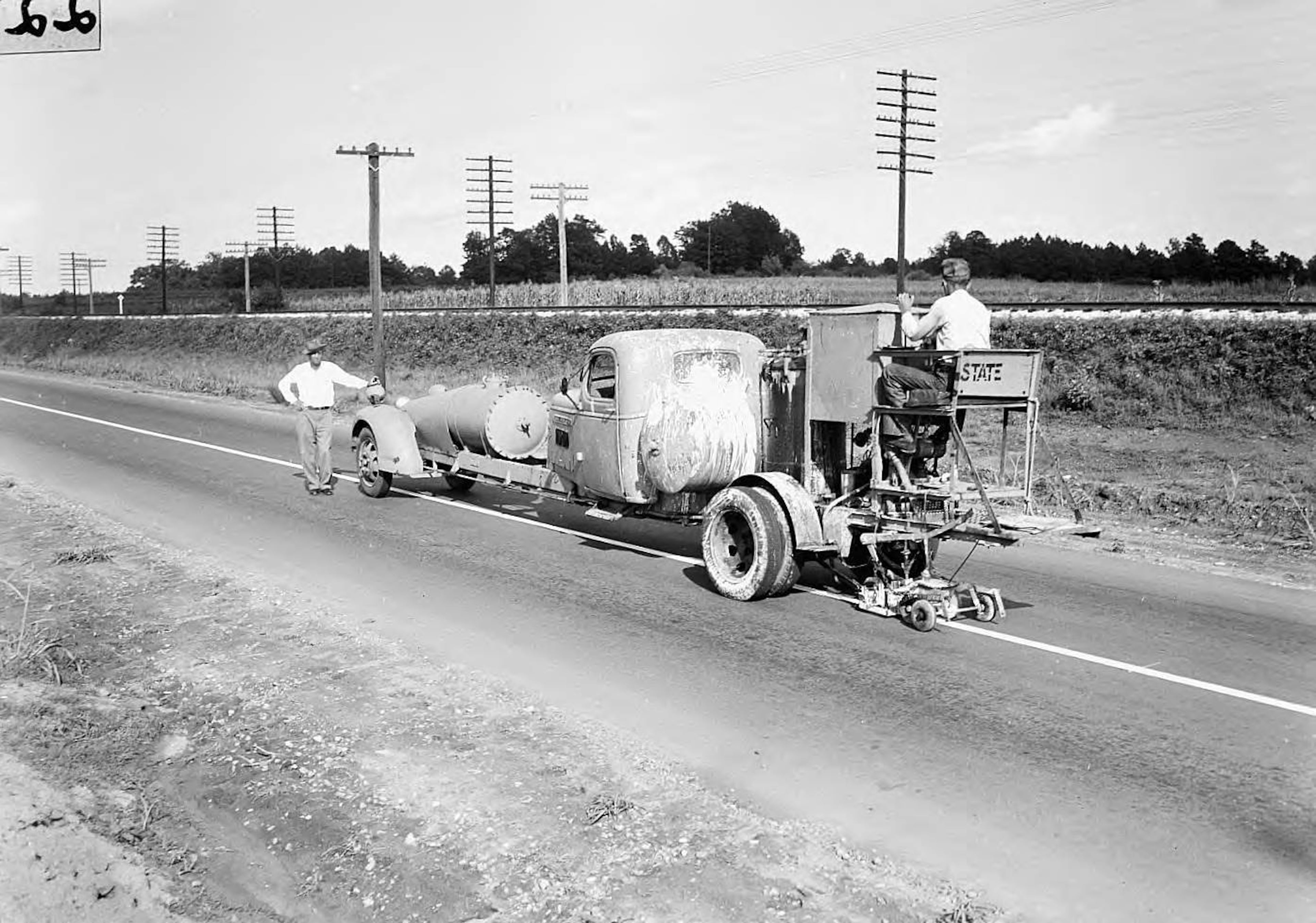Marking the lines on a new highway, Coweta County, Georgia, August 1944. Citation LBCB103-050b, Lane Brothers Commercial Photographers Photographic Collection, 1920-1976. Photographic Collection, Special Collections and Archives, Georgia State University Library.