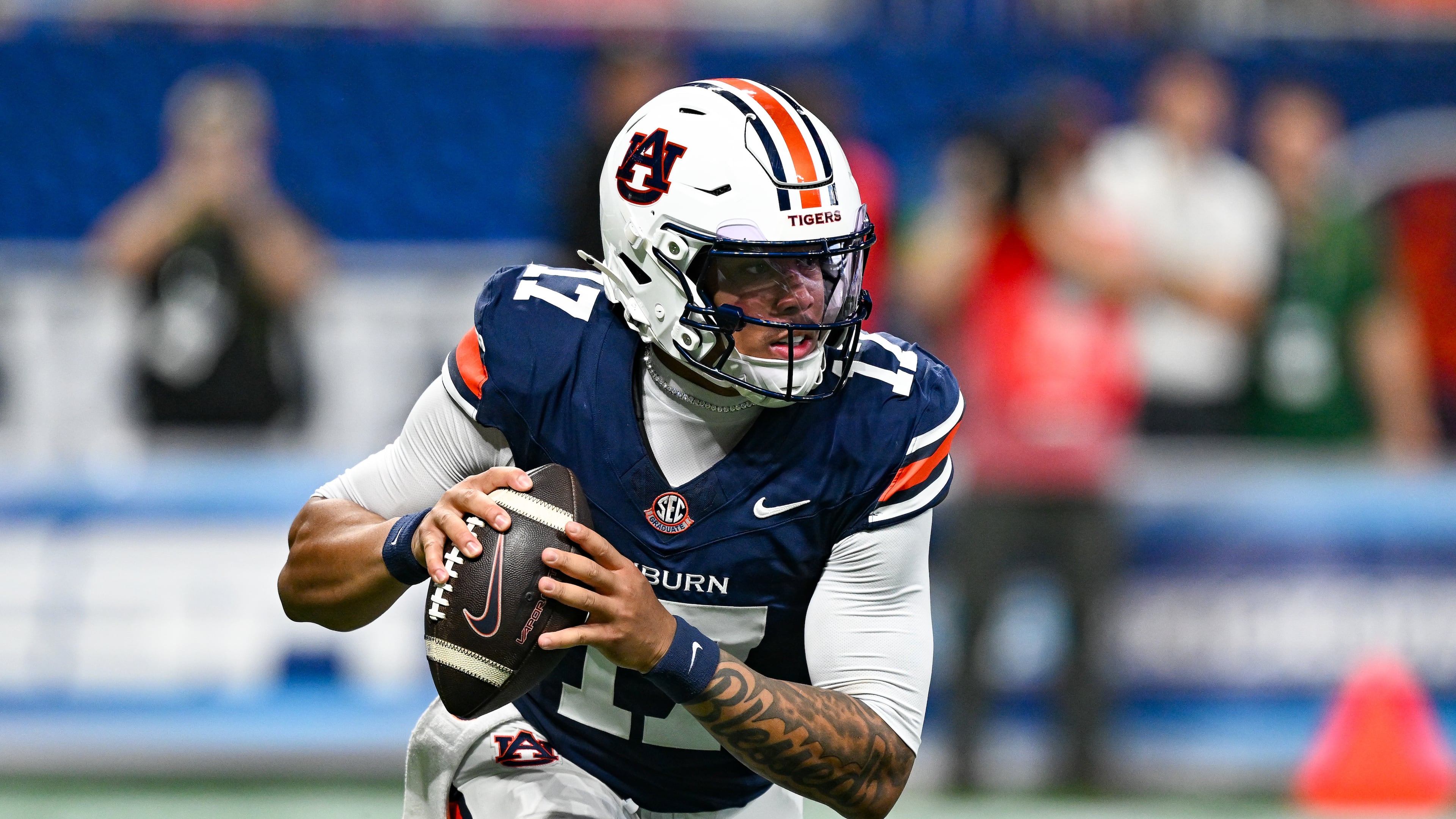 Auburn quarterback Byrum Brown rolls out to pass during the Aflac Kickoff Game between the Baylor Bears and the Auburn Tigers on September 5, 2026, at Mercedes-Benz Stadium in Atlanta, GA. (Photo by Rich von Biberstein/Icon Sportswire) (Icon Sportswire via AP Images)