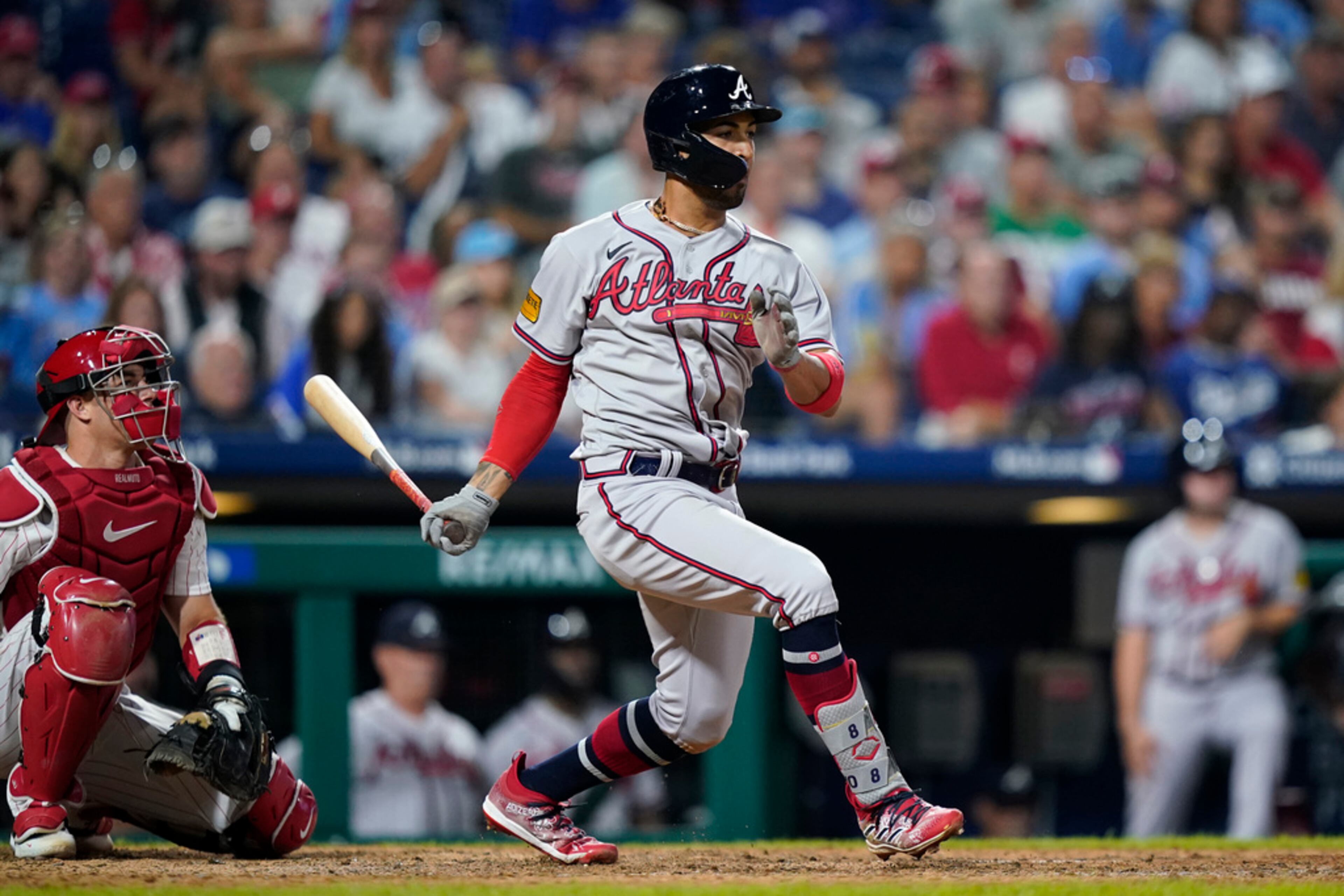 Atlanta Braves' Eddie Rosario follows through after hitting a run-scoring single against Philadelphia Phillies pitcher Craig Kimbrel during the 10th inning of a baseball game, Tuesday, Sept. 12, 2023, in Philadelphia. (AP Photo/Matt Slocum)
