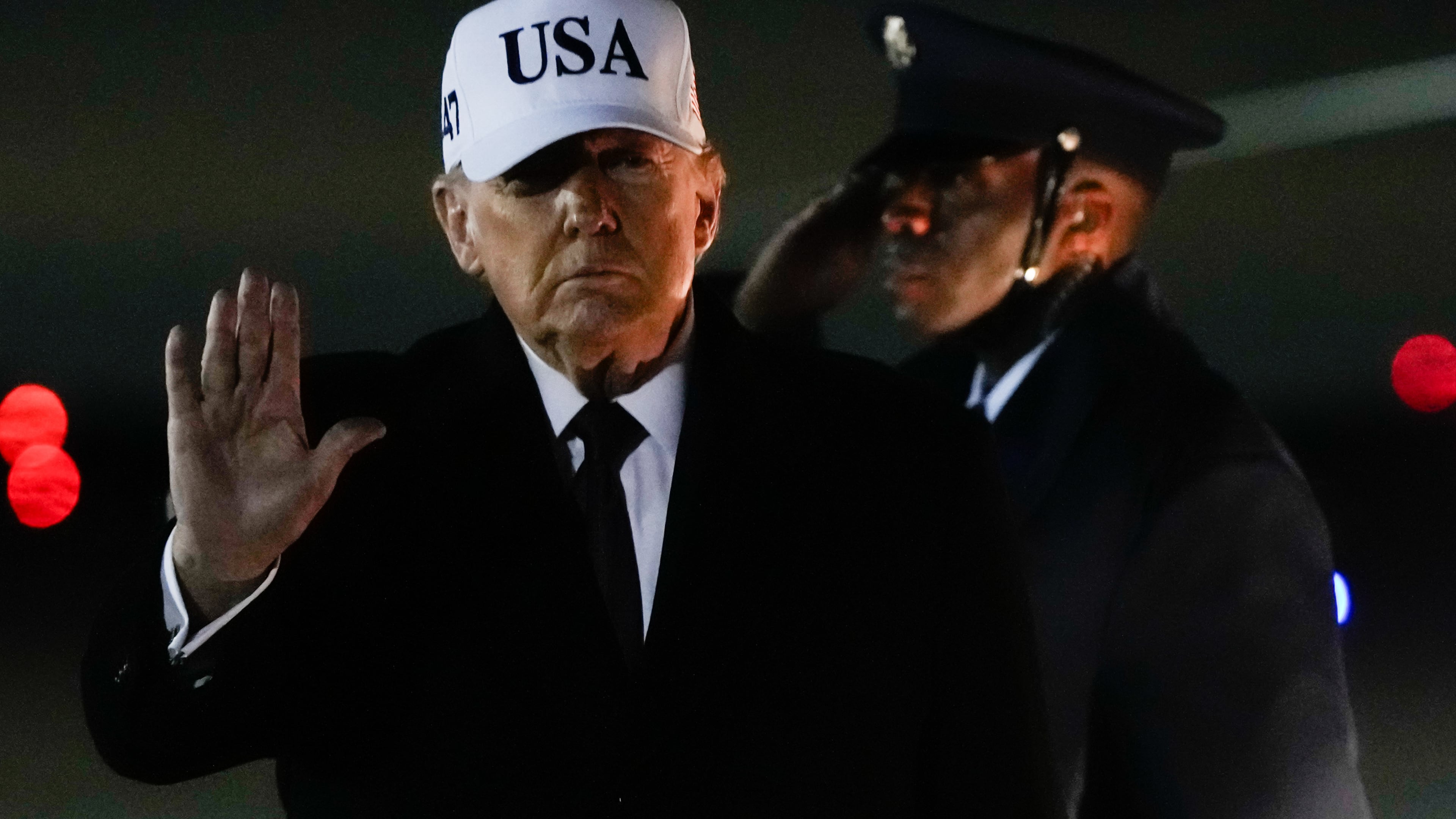 FILE - President Donald Trump waves after arriving on Air Force One from Florida, Jan. 11, 2026, at Joint Base Andrews, Md. (AP Photo/Julia Demaree Nikhinson, File)