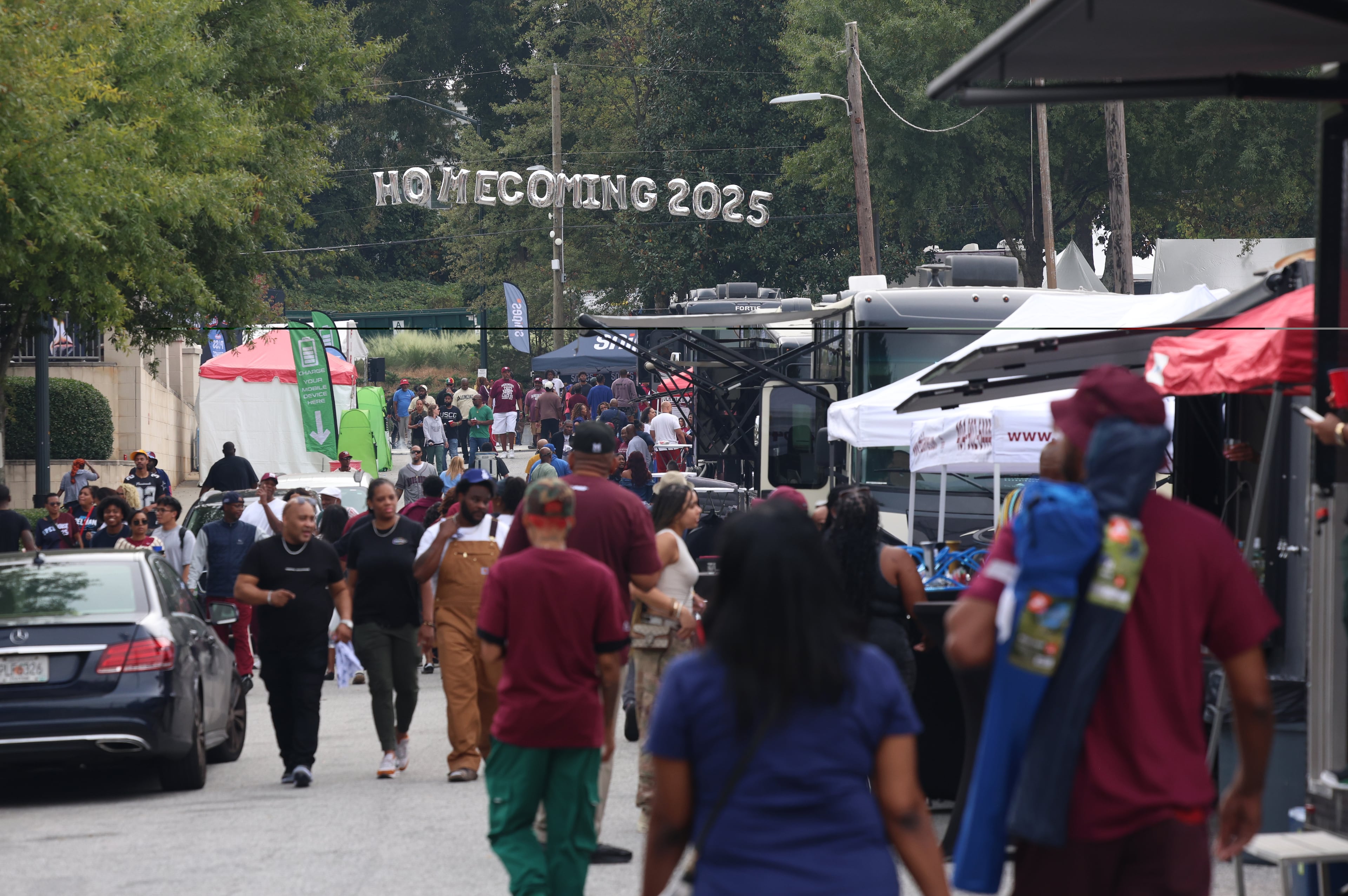 People attend the Morehouse Homecoming Tailgate Experience, one of the many events celebrating Spelhouse Homecoming, a joint commemoration between Morehouse and Spelman colleges.(Akili-Casundria Ramsess, EyeAkili Media for the AJC)