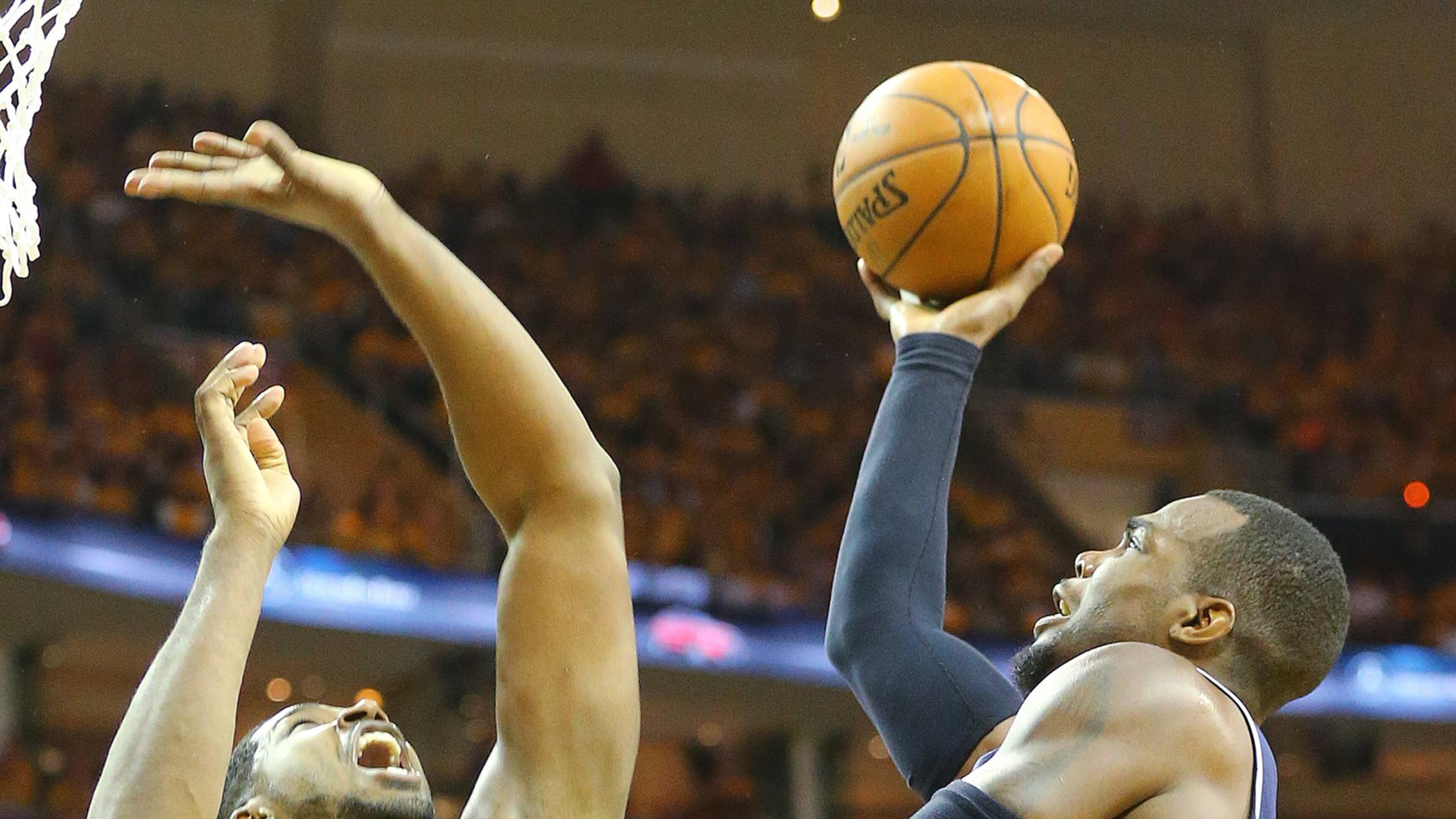Hawks Paul Millsap scores against Cavaliers Tristan Thompson in the Eastern Conference Finals on Sunday, May 24, 2015, in Cleveland. Curtis Compton / ccompton@ajc.com