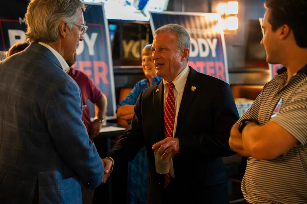 U.S. Rep. Buddy Carter greets supporters while watching election results in May in Sandy Springs. (Olivia Bowdoin for the AJC)