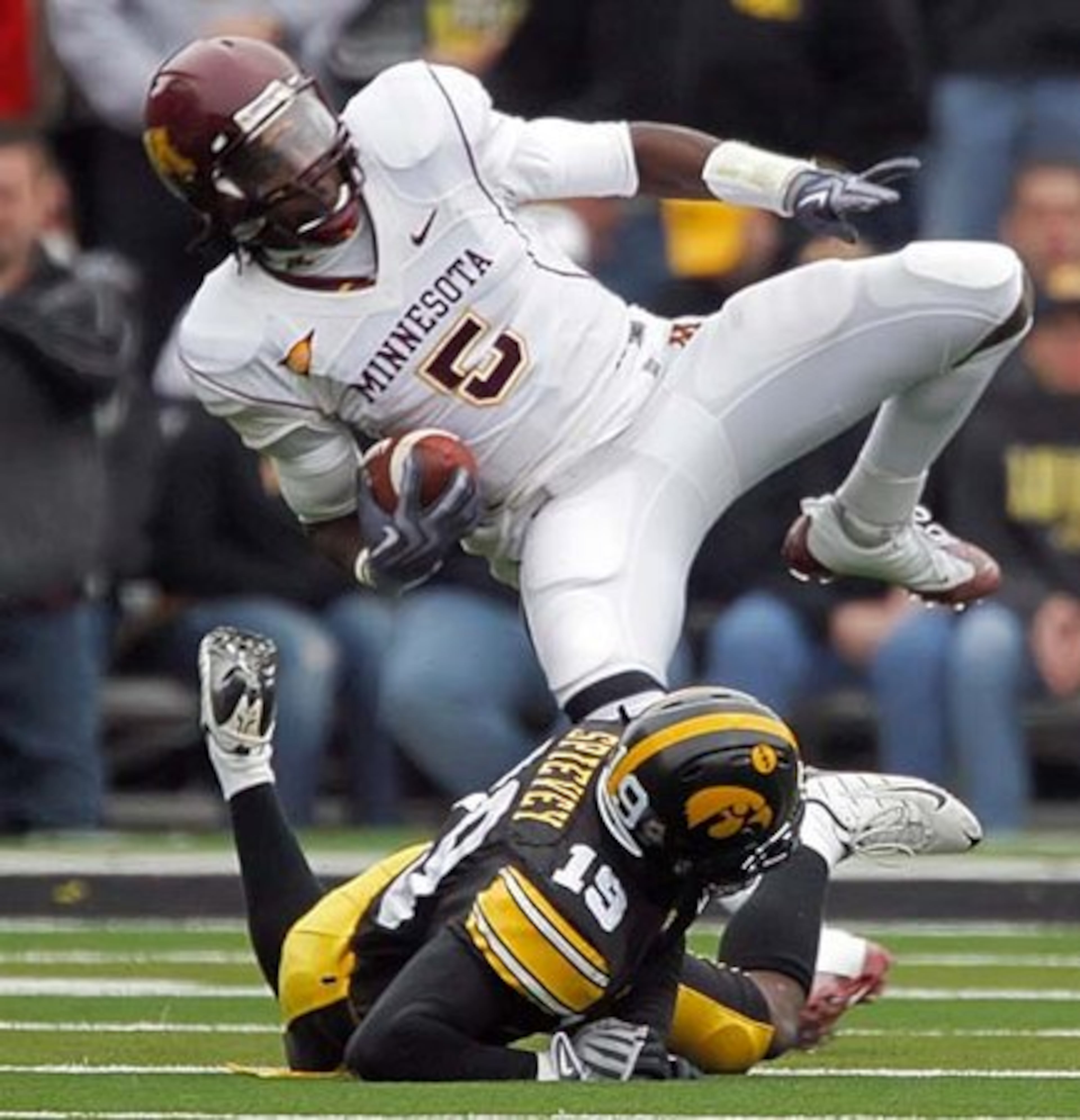 Junior Hawkeyes DB AMARI SPIEVEY (19, bottom) has six INTs over the past two seasons.