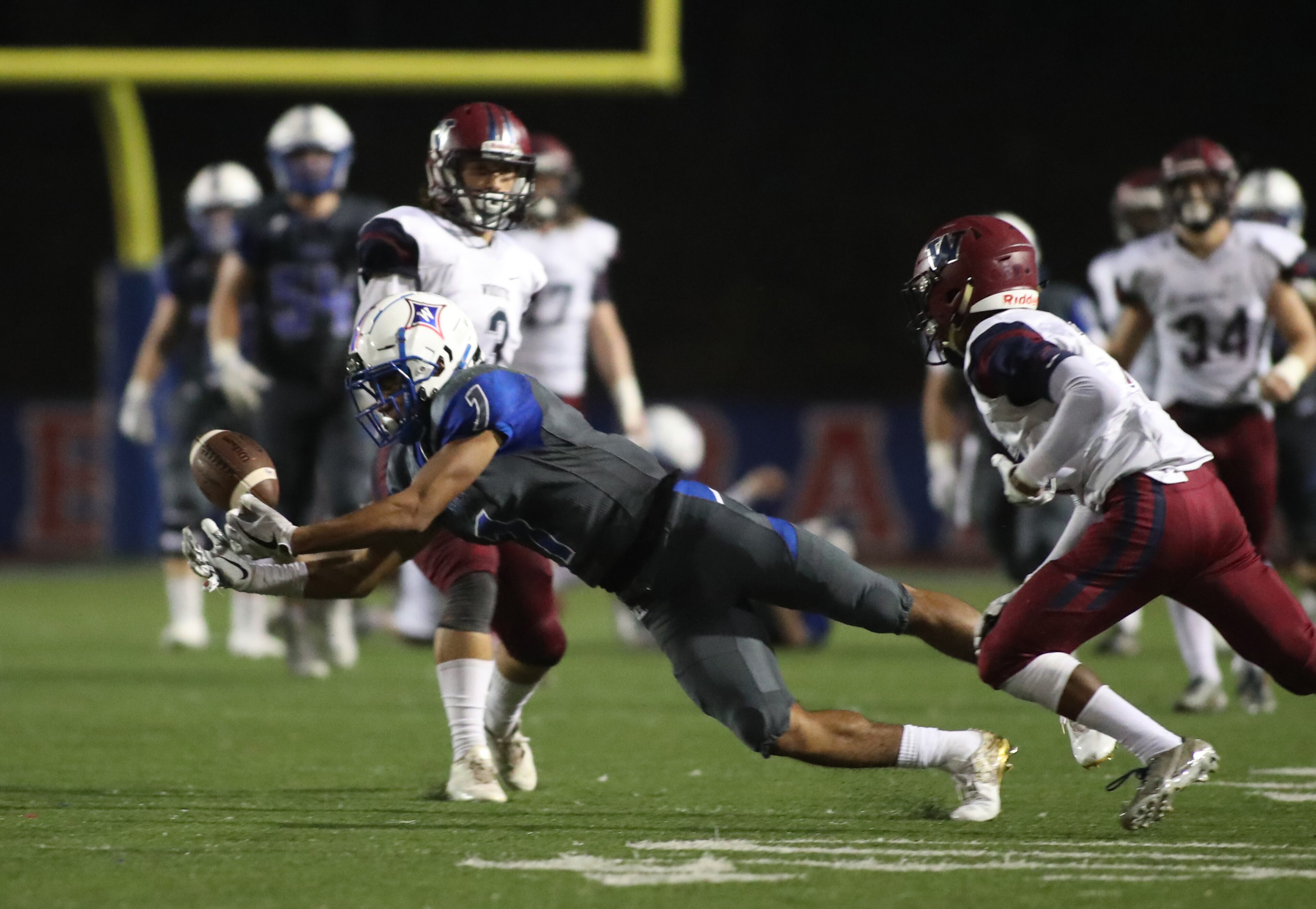 Walton wide receiver Dominick Blaylock (1) makes a juggling catch in the second half of their game against Woodstock at Walton High School Friday, November 3, 2017, in Marietta. Walton won 42-37. PHOTO / JASON GETZ