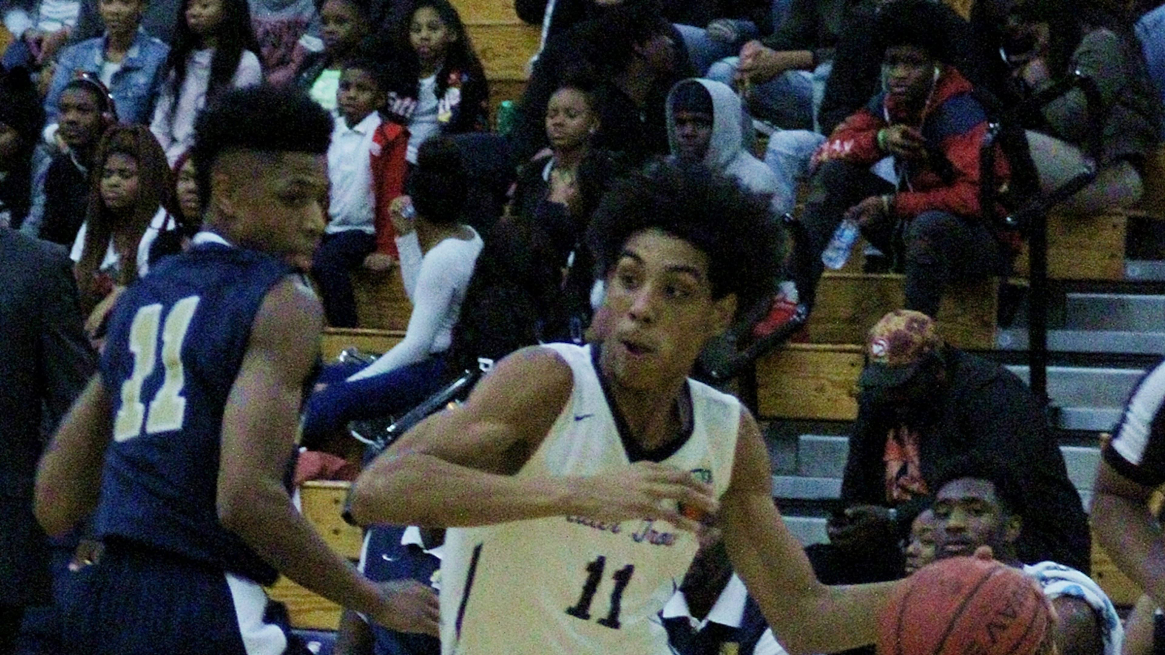 Southwest DeKalb's Eugene Brown tries to get past Miller Grove's Terrence Edwards. (Photo - Mark Brock)