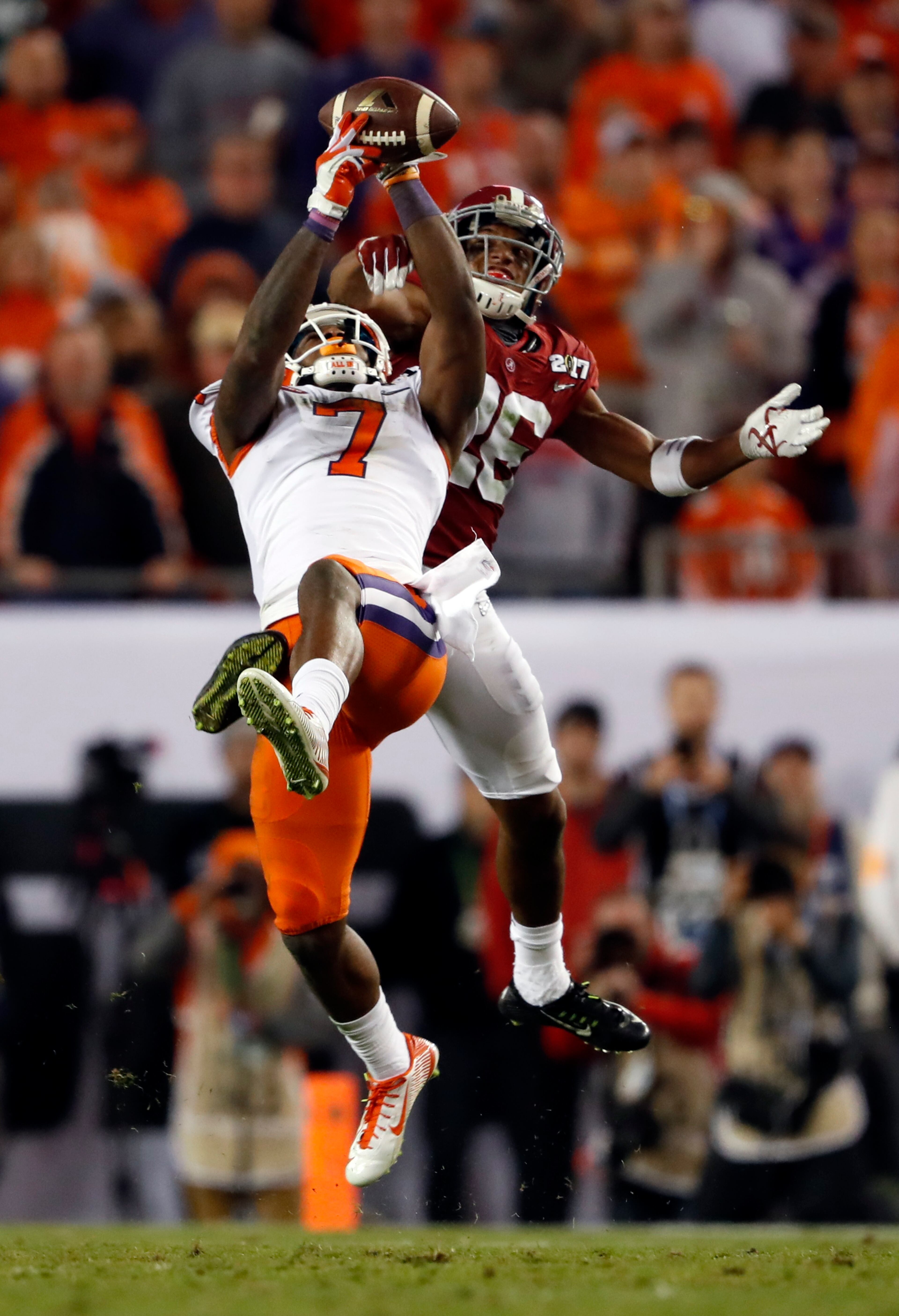 Clemson's Mike Williams catches a pass in front of Alabama's Marlon Humphrey during the second half of the NCAA college football playoff championship game Tuesday, Jan. 10, 2017, in Tampa, Fla. (AP Photo/John Bazemore)