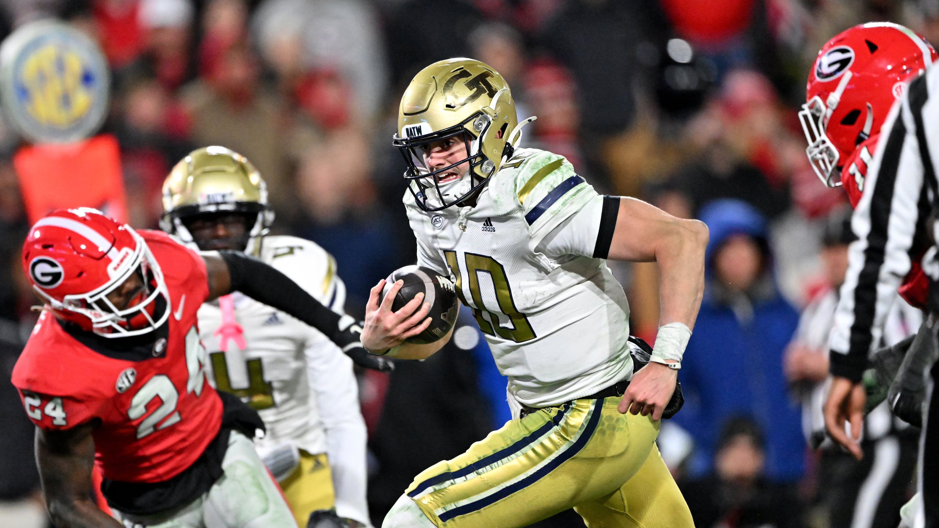 Georgia Tech quarterback Haynes King (10) runs for a touchdown during the fourth quarter in an NCAA football game at Sanford Stadium, Friday, November 29, 2024, in Athens. Georgia won 44-42 in eight overtimes. (Hyosub Shin / AJC)