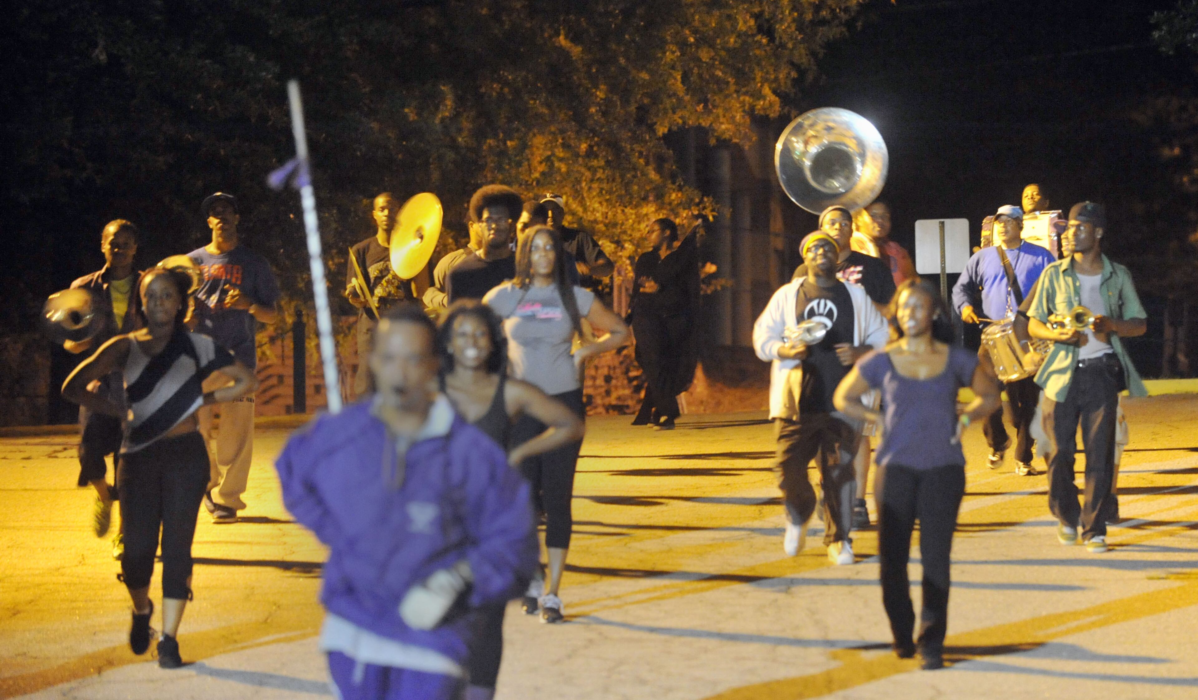 Members of the Morris Brown College Marching Wolverines band rehearse into the night Thursday for Saturday's Homecoming Celebration.