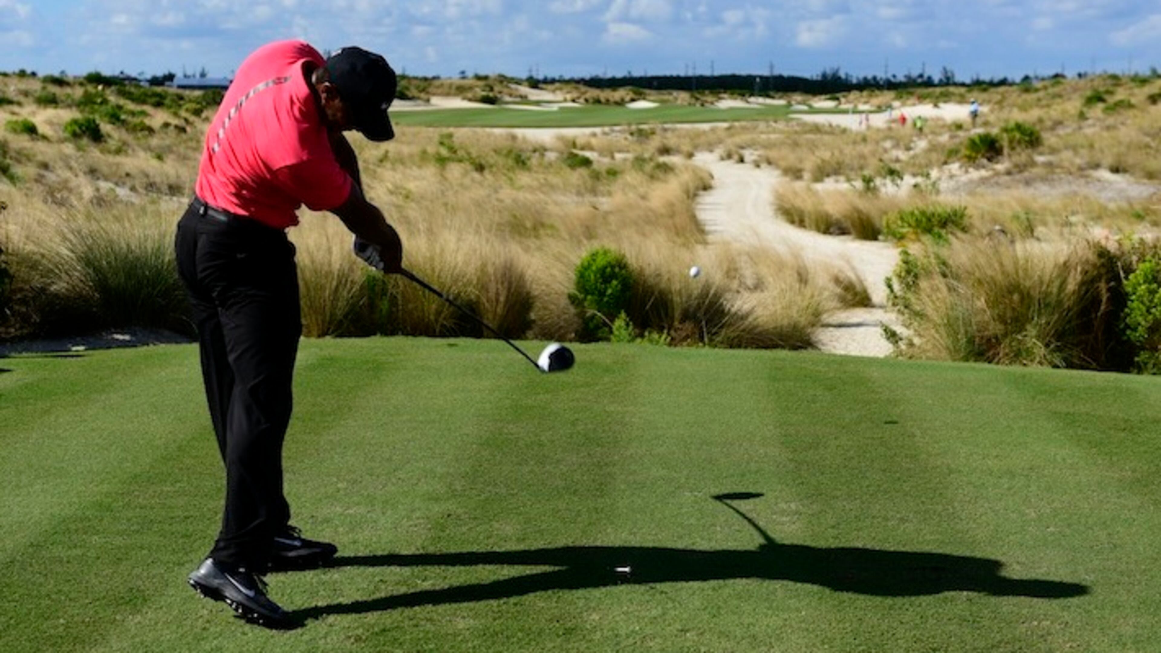 In this Dec. 3, 2017, file photo, Tiger Woods tees off from the 14th hole during the final round of the Hero World Challenge golf tournament at Albany Golf Club in Nassau, Bahamas. How Woods fares this year is one of the top story lines for 2018. (AP Photo/Dante Carrer, File)