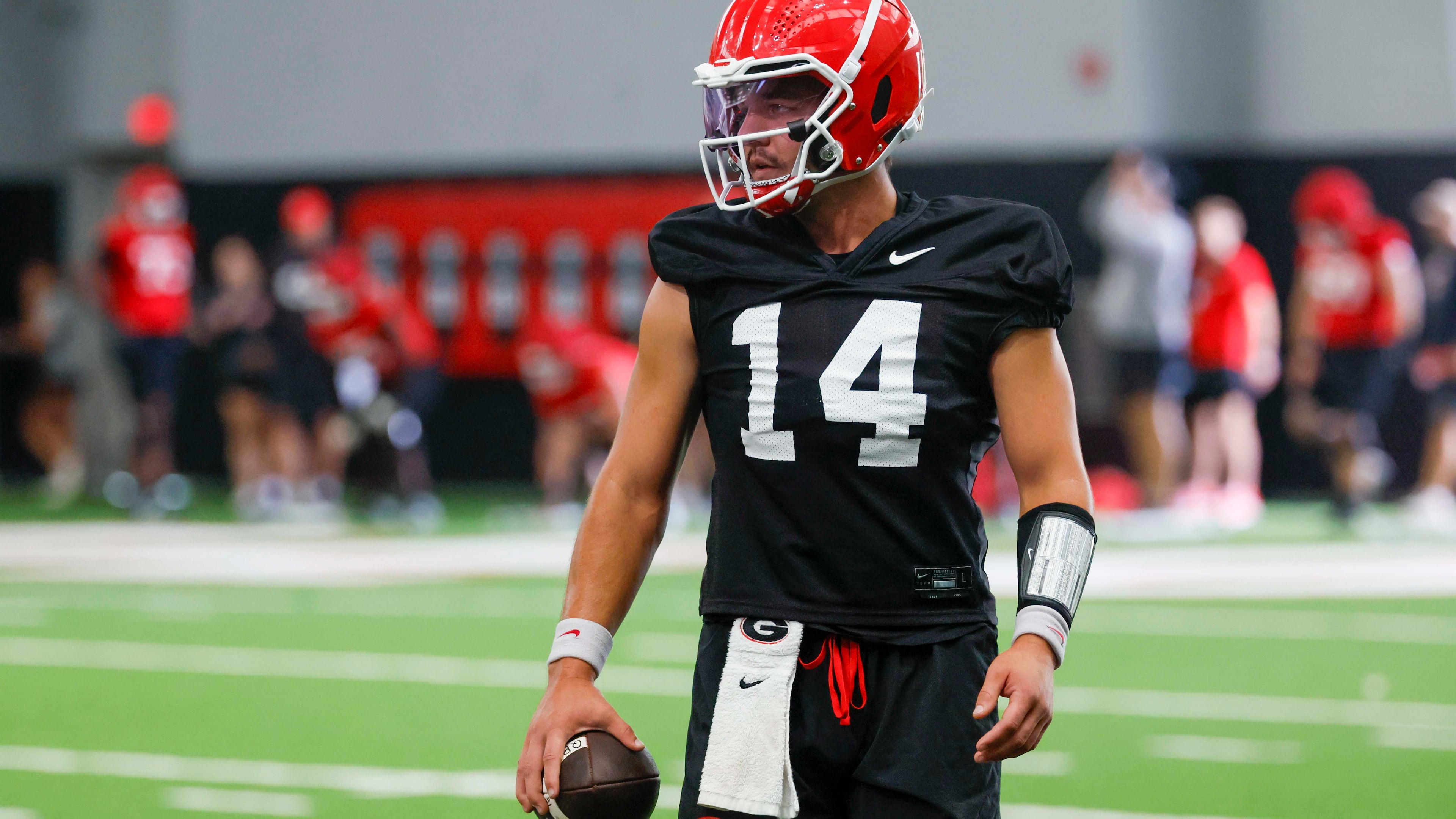 Georgia quarterback Gunner Stockton holds the ball during their first football practice at the University of Georgia practice facility, Wednesday, August 5, 2026, in Athens, Ga. (Miguel Martinez/AJC)