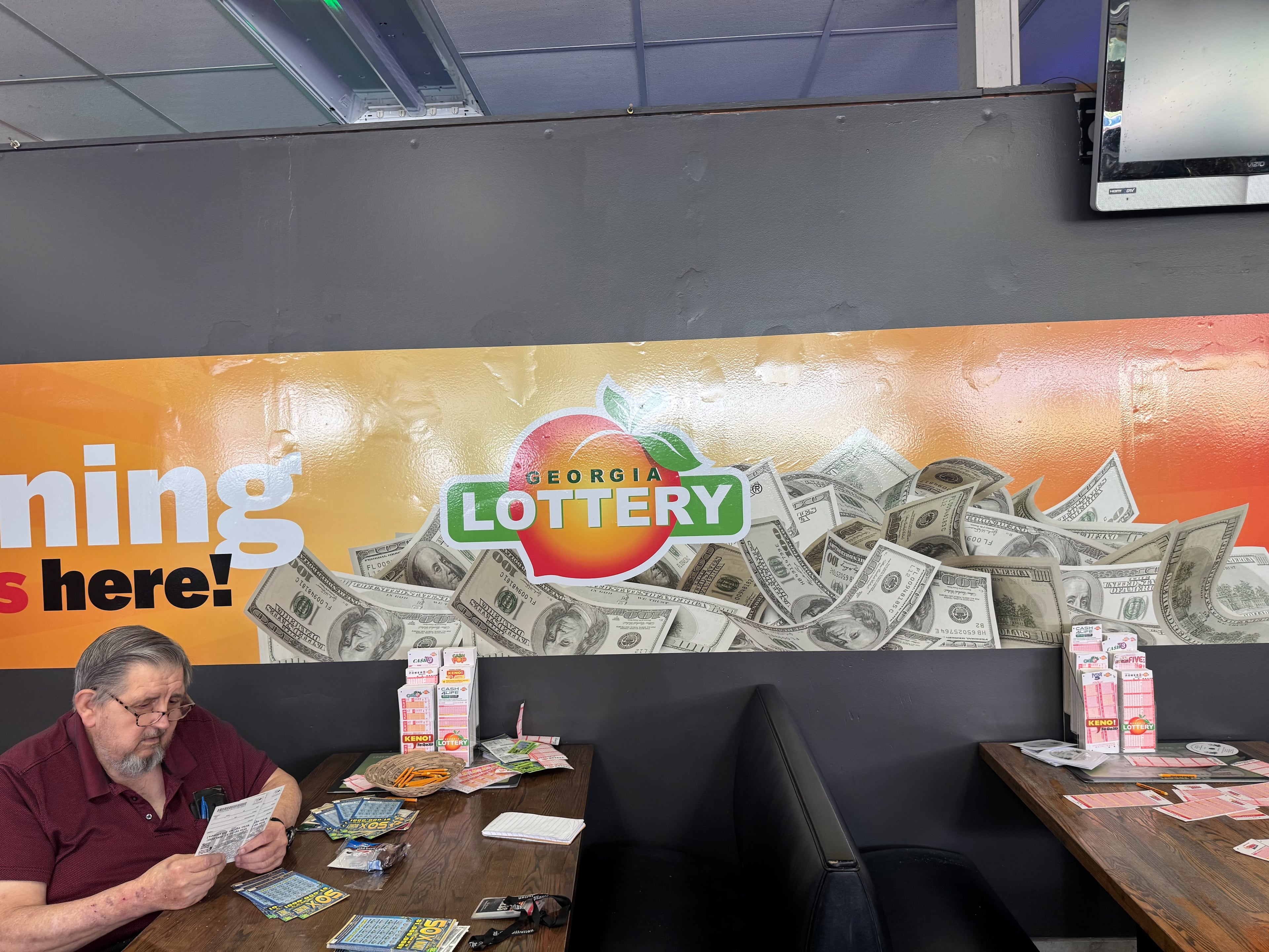 Alan Nunnally comes out nearly every Saturday to Tallapoosa’s Robinson and Sons. Nunnally says he enjoys playing, but he wishes more lottery winners came from Southern states. (Caleb Groves/AJC)